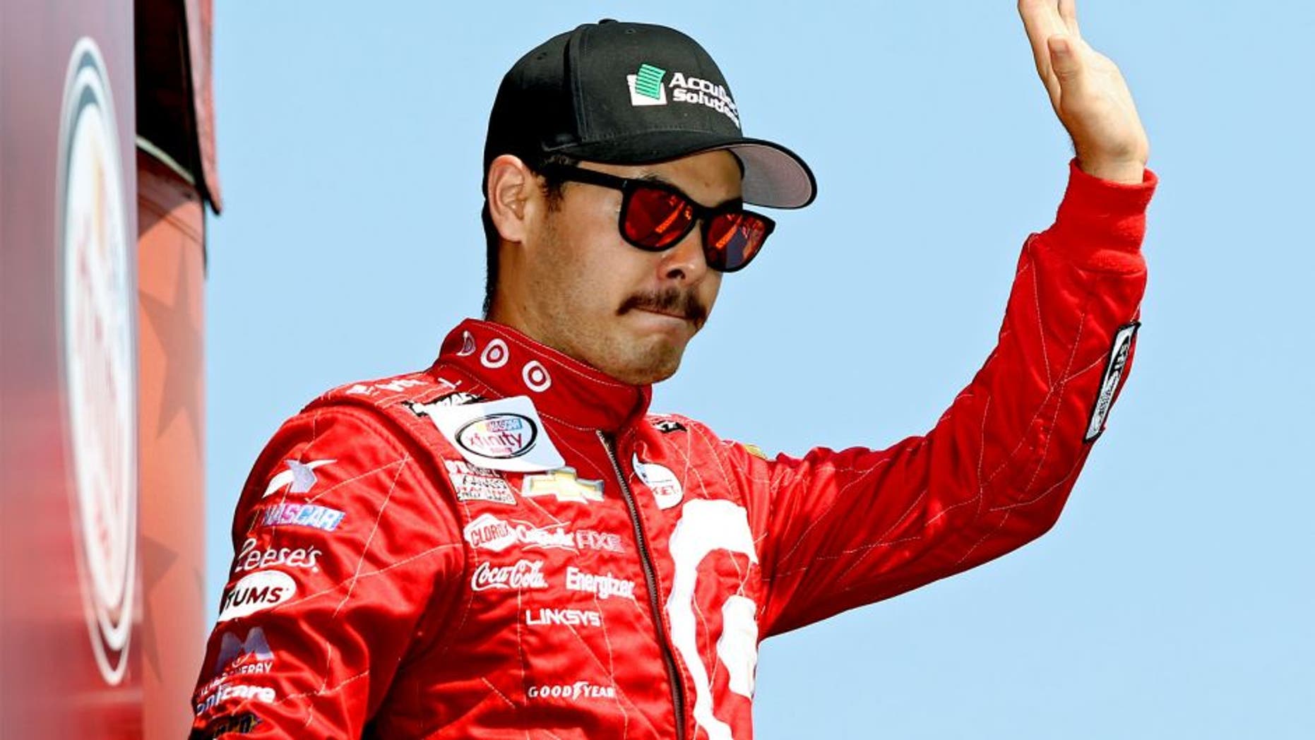 DARLINGTON, SC - SEPTEMBER 05: Kyle Larson, driver of the #42 AccuDoc Solutions Chevrolet, takes part in pre-race ceremonies for the NASCAR XFINITY Series VFW Sport Clips Help A Hero 200 at Darlington Raceway on September 5, 2015 in Darlington, South Carolina. (Photo by Kena Krutsinger/Getty Images)