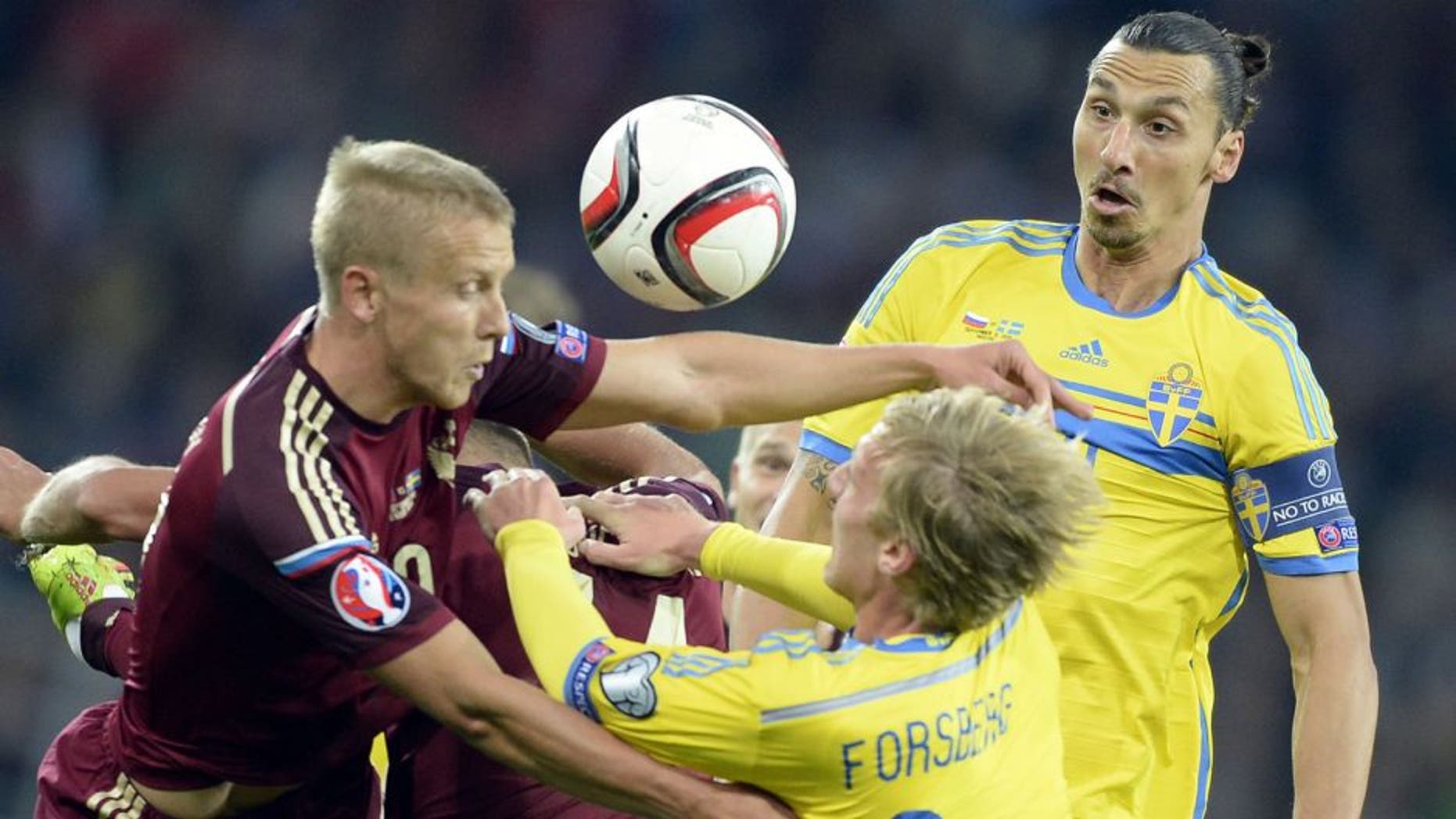 Sweden's forward Zlatan Ibrahimovic (R) and Sweden's midfielder Emil Forsberg (C) fight for the ball with Russia's midfielder Alan Dzagoev (L) during their UEFA Euro 2016 qualifying round Group G football match between Russia and Sweden at Otkrytie Arena in Moscow on September 5, 2015. AFP PHOTO / ALEXANDER NEMENOV (Photo credit should read ALEXANDER NEMENOV/AFP/Getty Images)