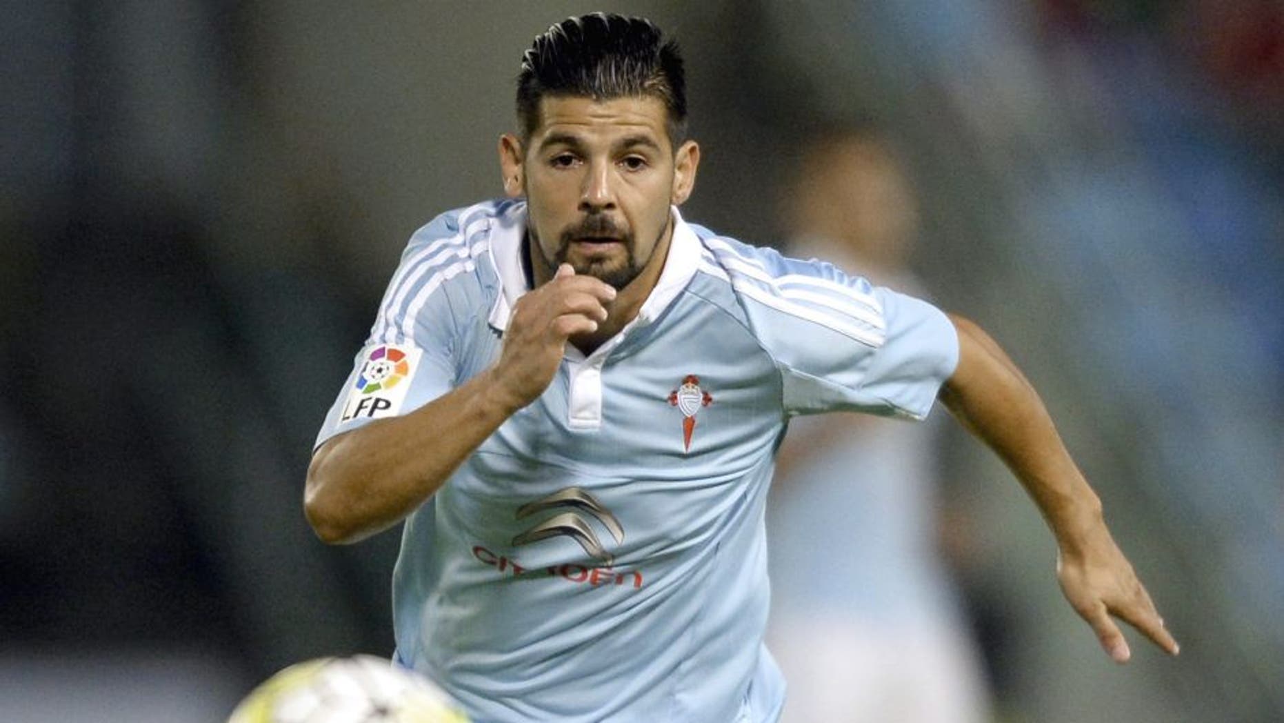 Celta Vigo's forward Nolito chases the ball during the Spanish league football match Celta Vigo vs Getafe CF at the Balaidos stadium in Vigo on October 2, 2015. AFP PHOTO / MIGUEL RIOPA (Photo credit should read MIGUEL RIOPA/AFP/Getty Images)