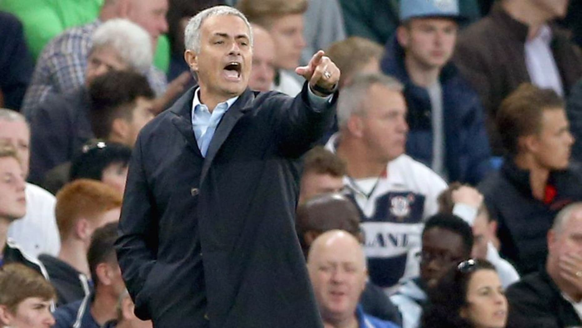 Chelsea's Portuguese manager Jose Mourinho gestures during the English Premier League football match between Chelsea and Southampton at Stamford Bridge in London on October 3, 2015. AFP PHOTO / JUSTIN TALLIS RESTRICTED TO EDITORIAL USE. No use with unauthorized audio, video, data, fixture lists, club/league logos or 'live' services. Online in-match use limited to 75 images, no video emulation. No use in betting, games or single club/league/player publications. (Photo credit should read JUSTIN TALLIS/AFP/Getty Images)