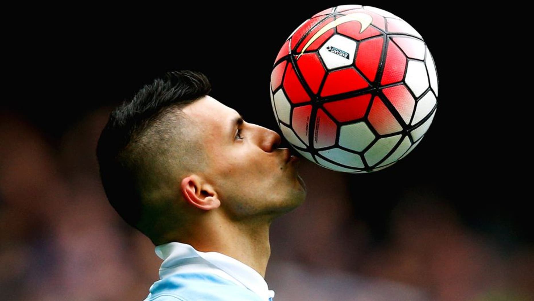 MANCHESTER, ENGLAND - OCTOBER 03: Sergio Aguero of Manchester City kisses the ball to celebrate a goal and his hat-trick during the Barclays Premier League match between Manchester City and Newcastle United at Etihad Stadium on October 3, 2015 in Manchester, United Kingdom. (Photo by Dean Mouhtaropoulos/Getty Images)
