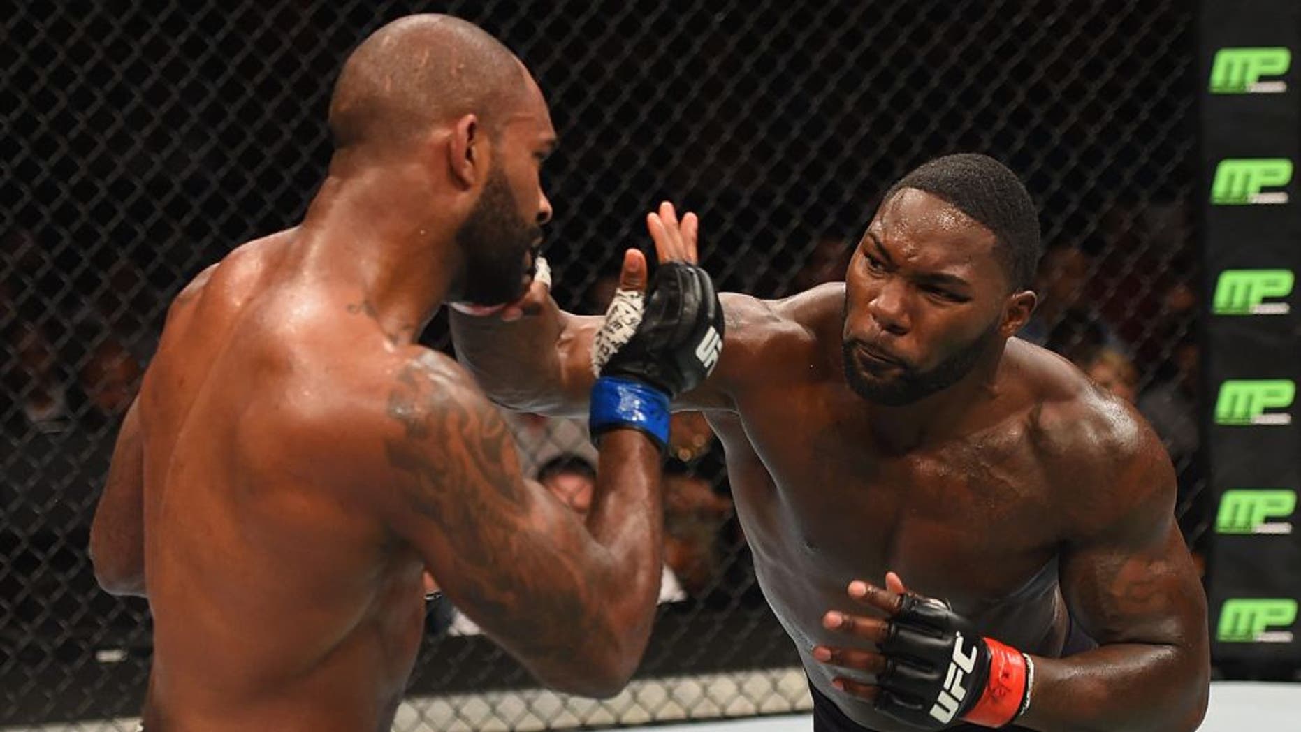 LAS VEGAS, NV - SEPTEMBER 05: (R-L) Anthony Johnson punches Jimi Manuwa in their light heavyweight bout during the UFC 191 event inside MGM Grand Garden Arena on September 5, 2015 in Las Vegas, Nevada. (Photo by Josh Hedges/Zuffa LLC/Zuffa LLC via Getty Images)
