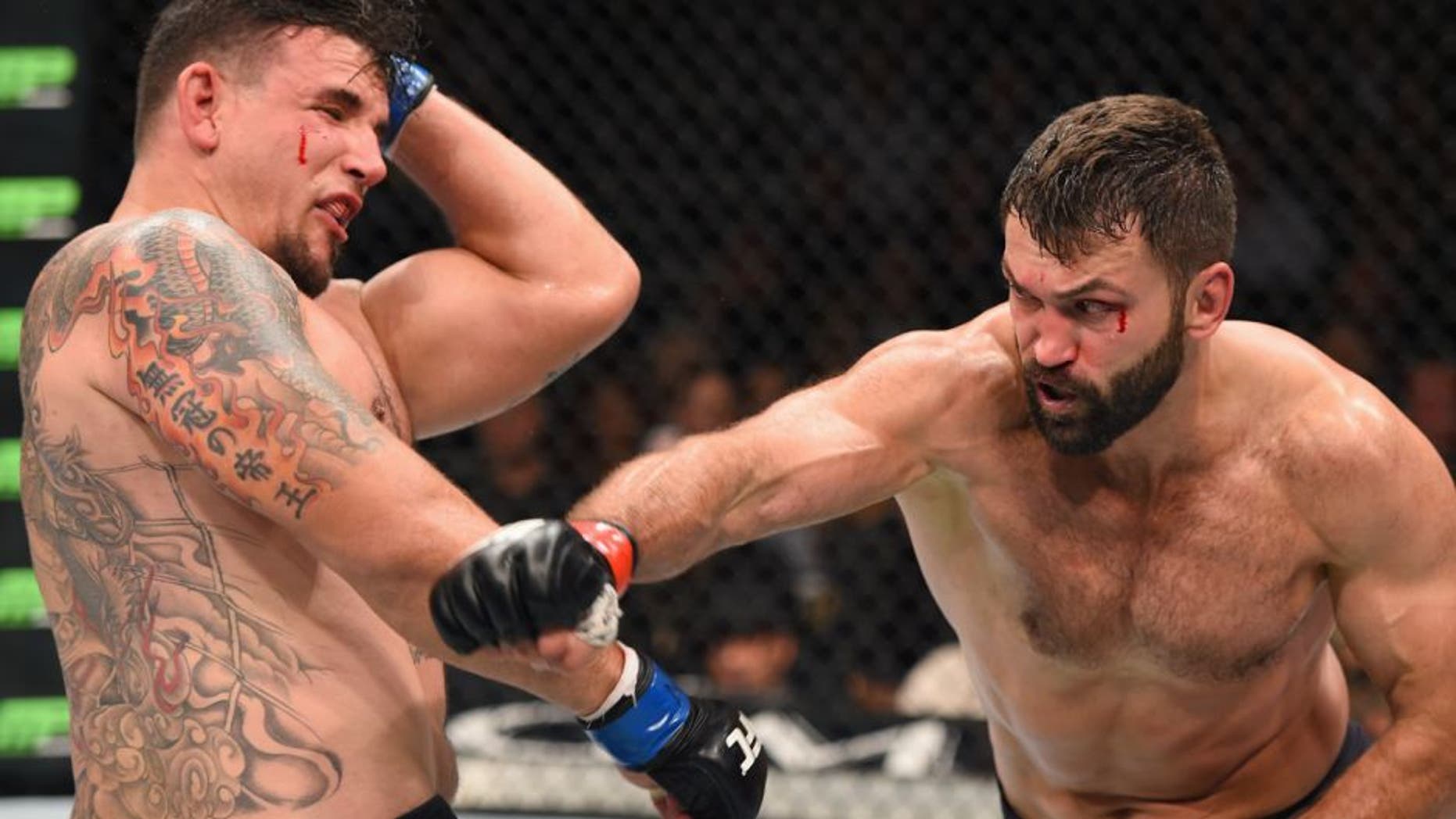 LAS VEGAS, NV - SEPTEMBER 05: (R-L) Andrei Arlovski punches Frank Mir in their heavyweight bout during the UFC 191 event inside MGM Grand Garden Arena on September 5, 2015 in Las Vegas, Nevada. (Photo by Josh Hedges/Zuffa LLC/Zuffa LLC via Getty Images)