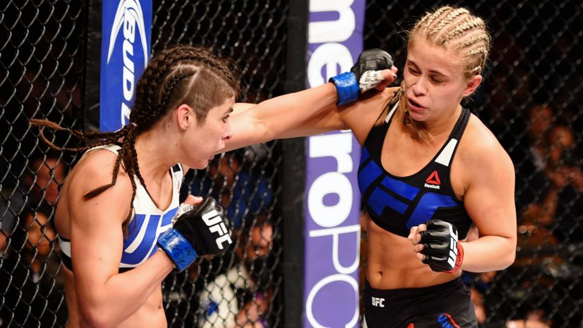 LAS VEGAS, NV - SEPTEMBER 05: (L-R) Alex Chambers punches Paige VanZant in their women's strawweight bout during the UFC 191 event inside MGM Grand Garden Arena on September 5, 2015 in Las Vegas, Nevada. (Photo by Josh Hedges/Zuffa LLC/Zuffa LLC via Getty Images)
