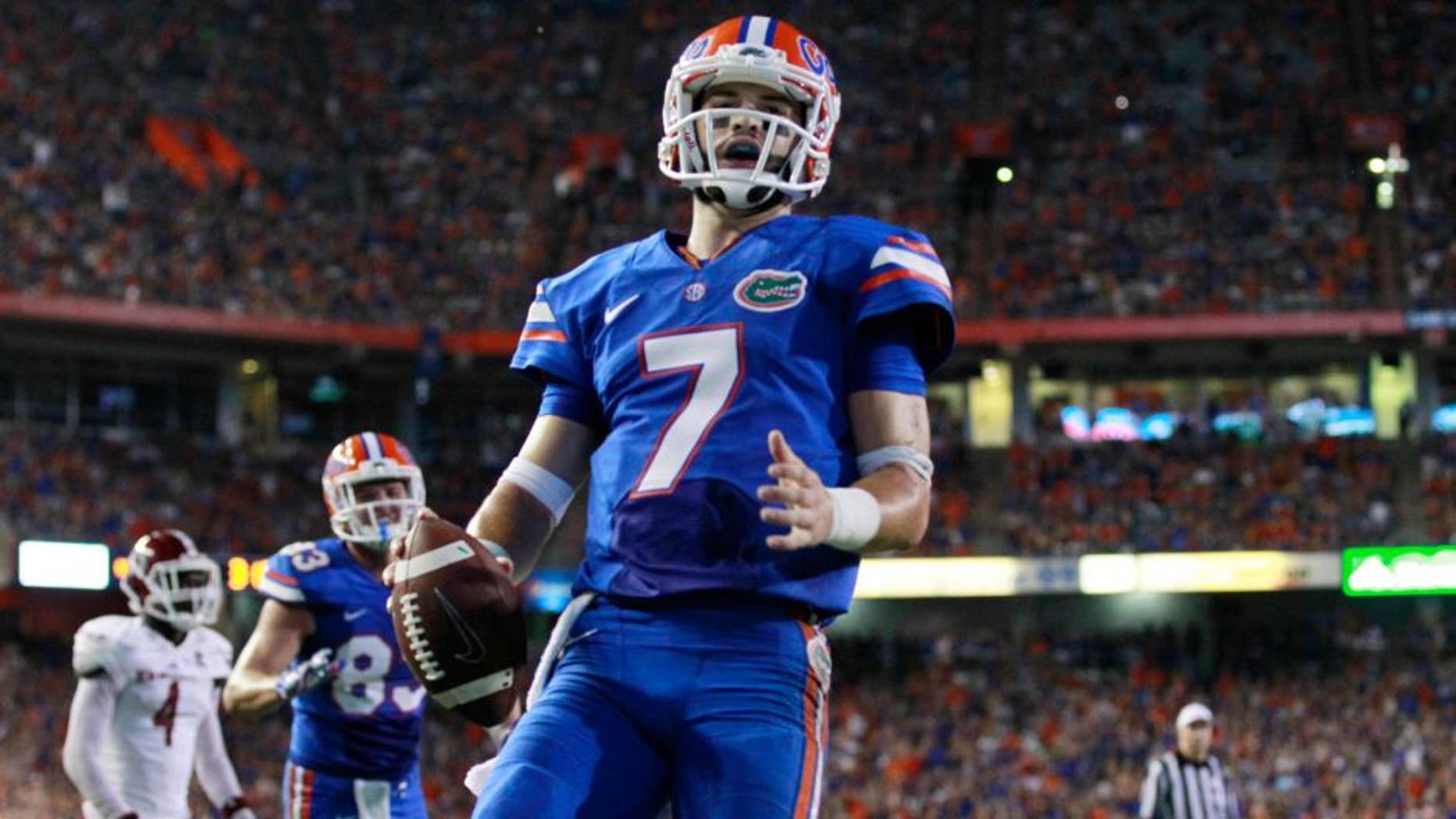 Sep 5, 2015; Gainesville, FL, USA; Florida Gators quarterback Will Grier (7) runs the ball in for a touchdown against the New Mexico State Aggies during the second quarter at Ben Hill Griffin Stadium. Mandatory Credit: Kim Klement-USA TODAY Sports