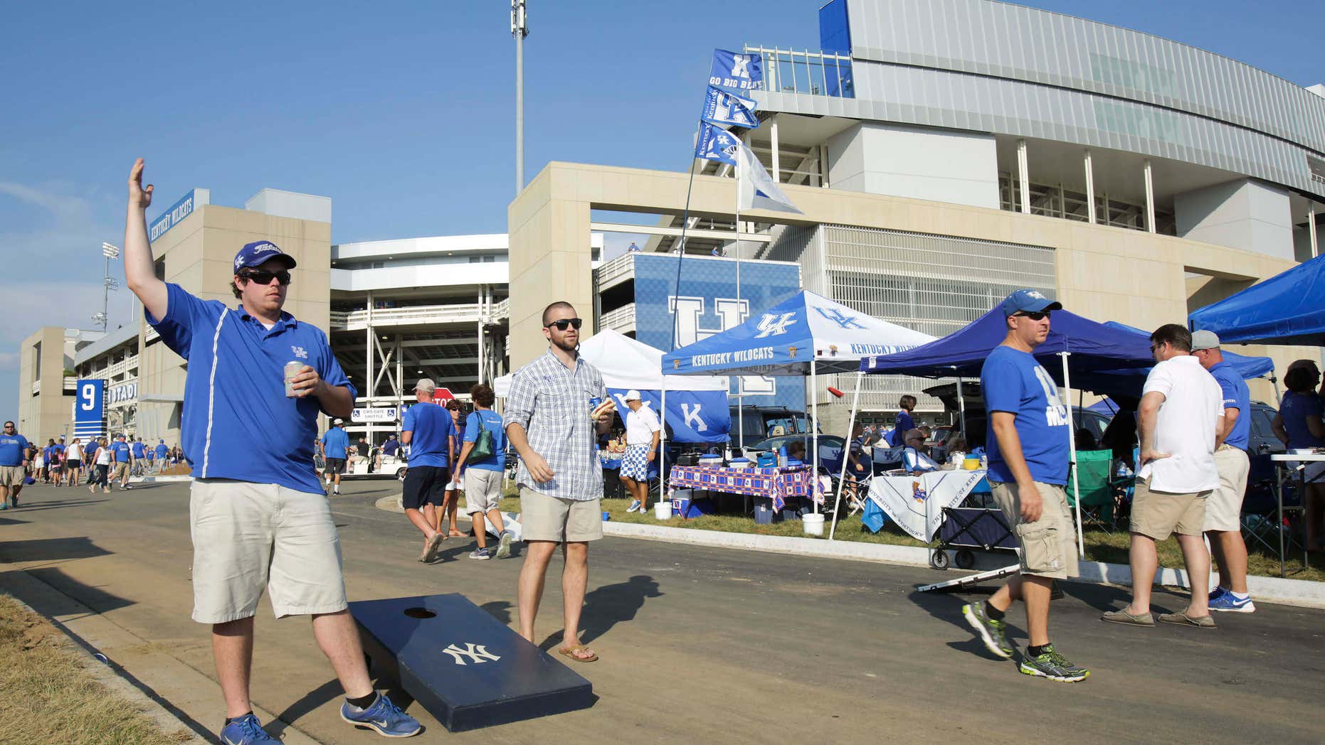 Sept. 5, 2015: Kentucky students Zac Houston, left, and Kyle Polley tailgate in the parking lot of the newly remodeled Commonwealth Stadium before Kentucky plays Louisiana-Lafayette in an NCAA college football game in Lexington, Ky.