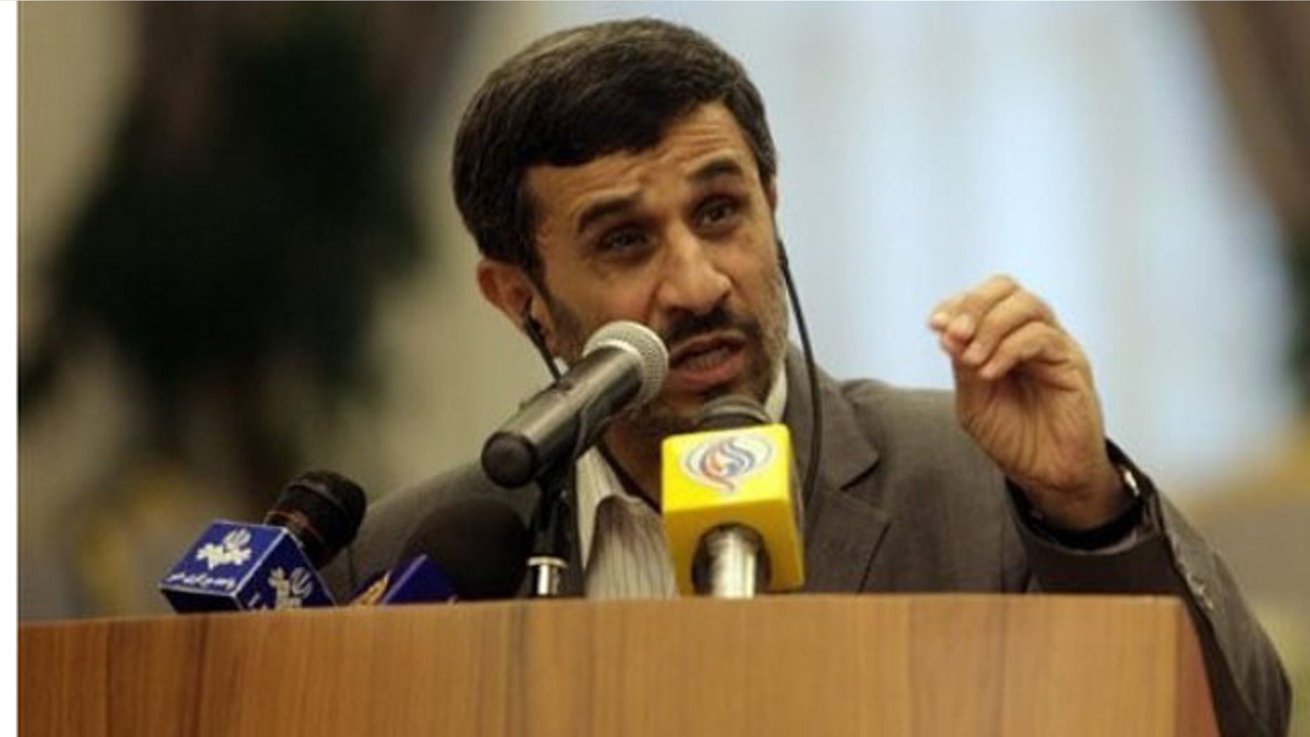 Sept. 5: Iranian President Mahmoud Ahmadinejad speaks during a joint press conference with Qatar's emir, Sheikh Hamad bin Khalifa al-Thani, unseen, at the royal palace in Doha, declaring that any attack on the Islamic republic will result in the destruction of Israel (AP).