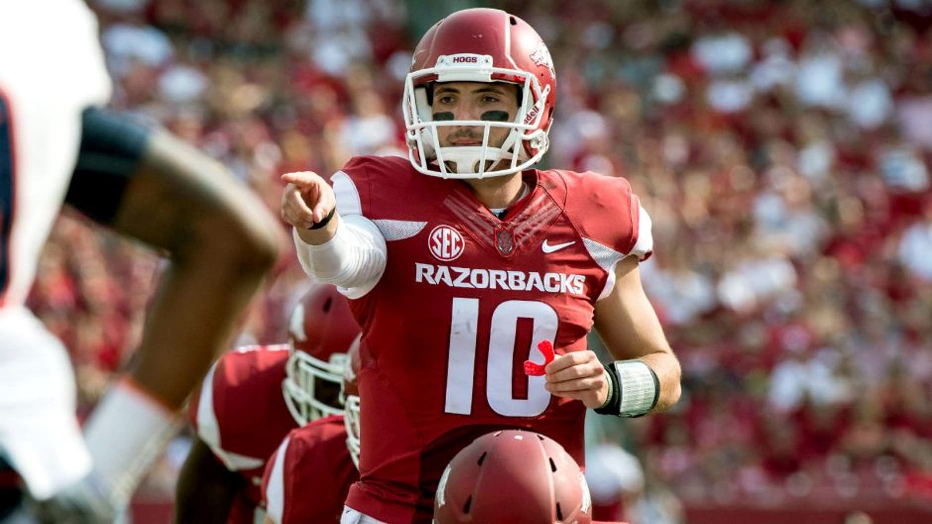 Sep 5, 2015; Fayetteville, AR, USA; Arkansas Razorbacks quarterback Brandon Allen (10) points to UTEP Miners defensive back Michael Lewis (39) during the second half at Donald W. Reynolds Razorback Stadium. The Razorbacks defeat the Miners 48-13. Mandatory Credit: Jerome Miron-USA TODAY Sports