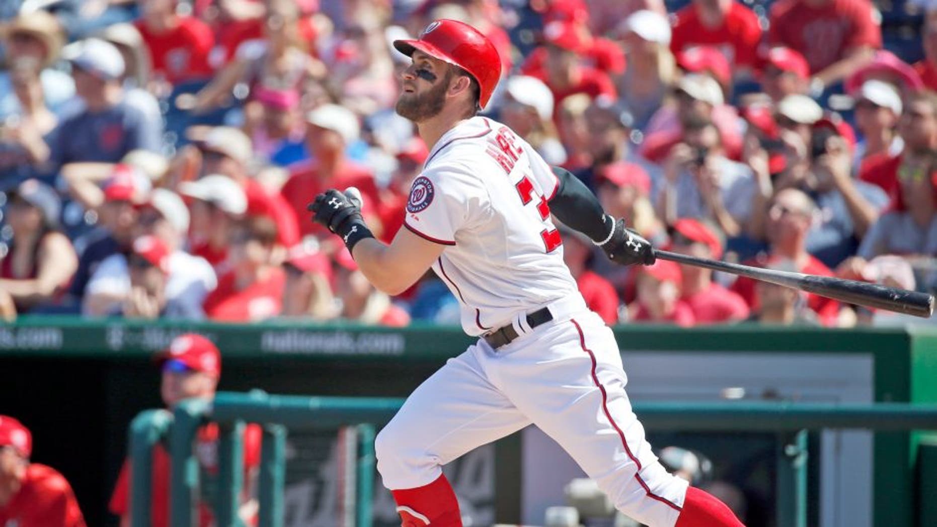 Washington Nationals' Bryce Harper watches his solo home run during the third inning of a baseball game against the Atlanta Braves at Nationals Park, Sunday, Sept. 6, 2015, in Washington. (AP Photo/Alex Brandon)