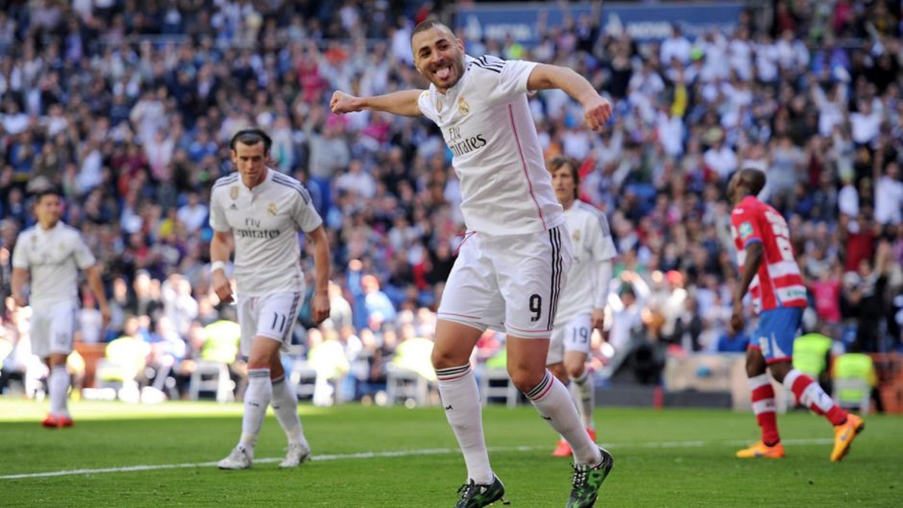 MADRID, SPAIN - APRIL 05: Karim Benzema of Real Madrid CF celebrates after scoring his team's 7th goal during the La Liga match between Real Madrid CF and Granada CF at Estadio Santiago Bernabeu on April 5, 2015 in Madrid, Spain. (Photo by Denis Doyle/Getty Images)