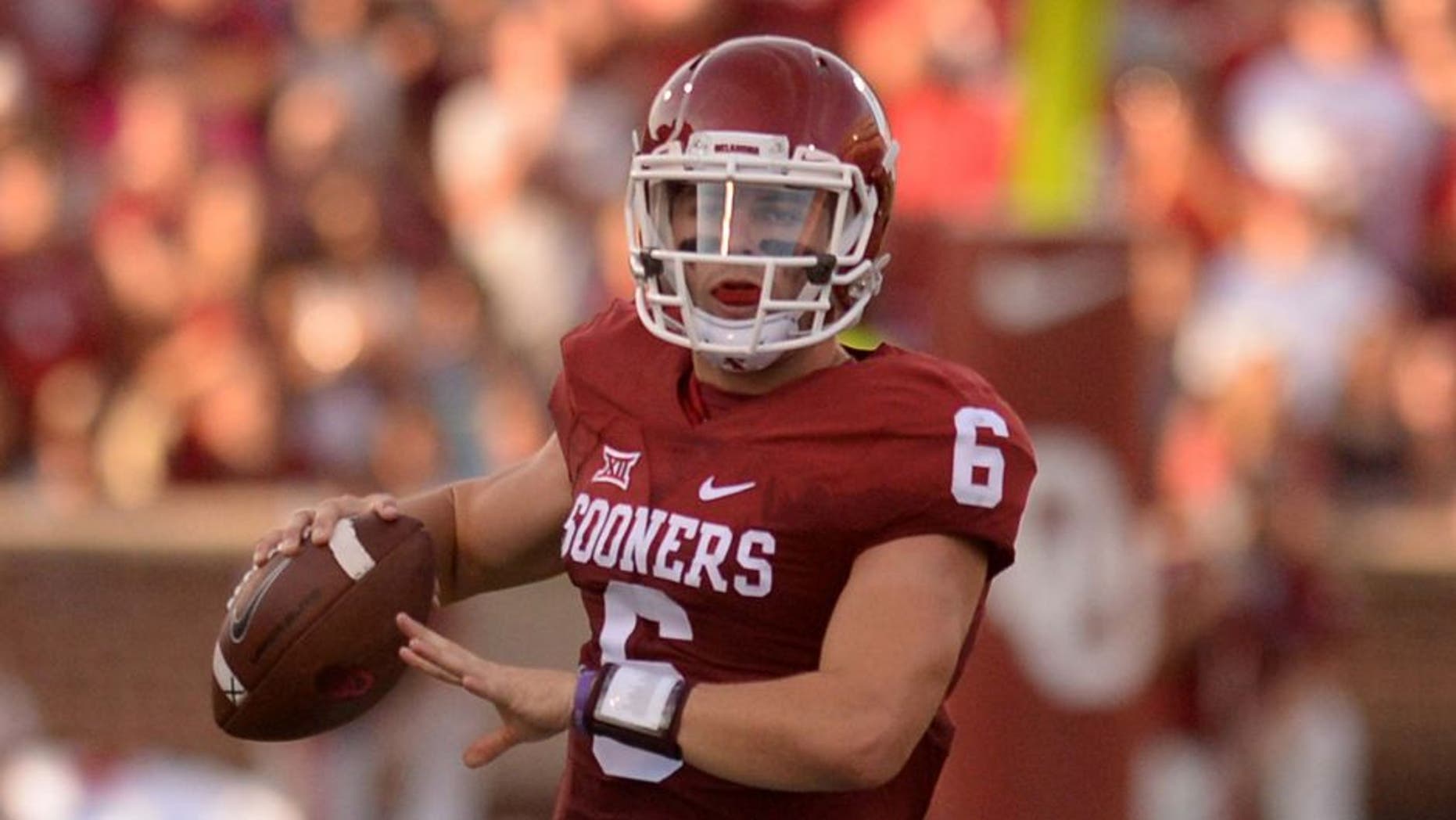 Sep 5, 2015; Norman, OK, USA; Oklahoma Sooners quarterback Baker Mayfield (6) runs with the ball while being pursued by Oklahoma Sooners linebacker Tay Evans (9) during the first quarter at Gaylord Family - Oklahoma Memorial Stadium. Mandatory Credit: Mark D. Smith-USA TODAY Sports