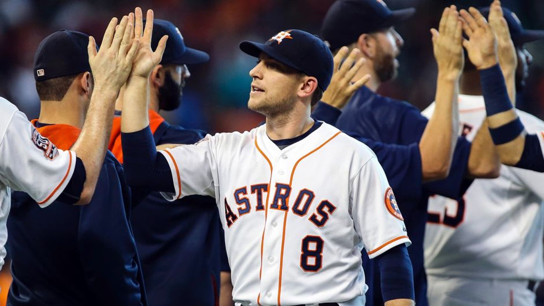 Sep 6, 2015; Houston, TX, USA; Houston Astros third baseman Jed Lowrie (8) celebrates with teammates after the Astros defeated the Minnesota Twins 8-5 at Minute Maid Park. Mandatory Credit: Troy Taormina-USA TODAY Sports