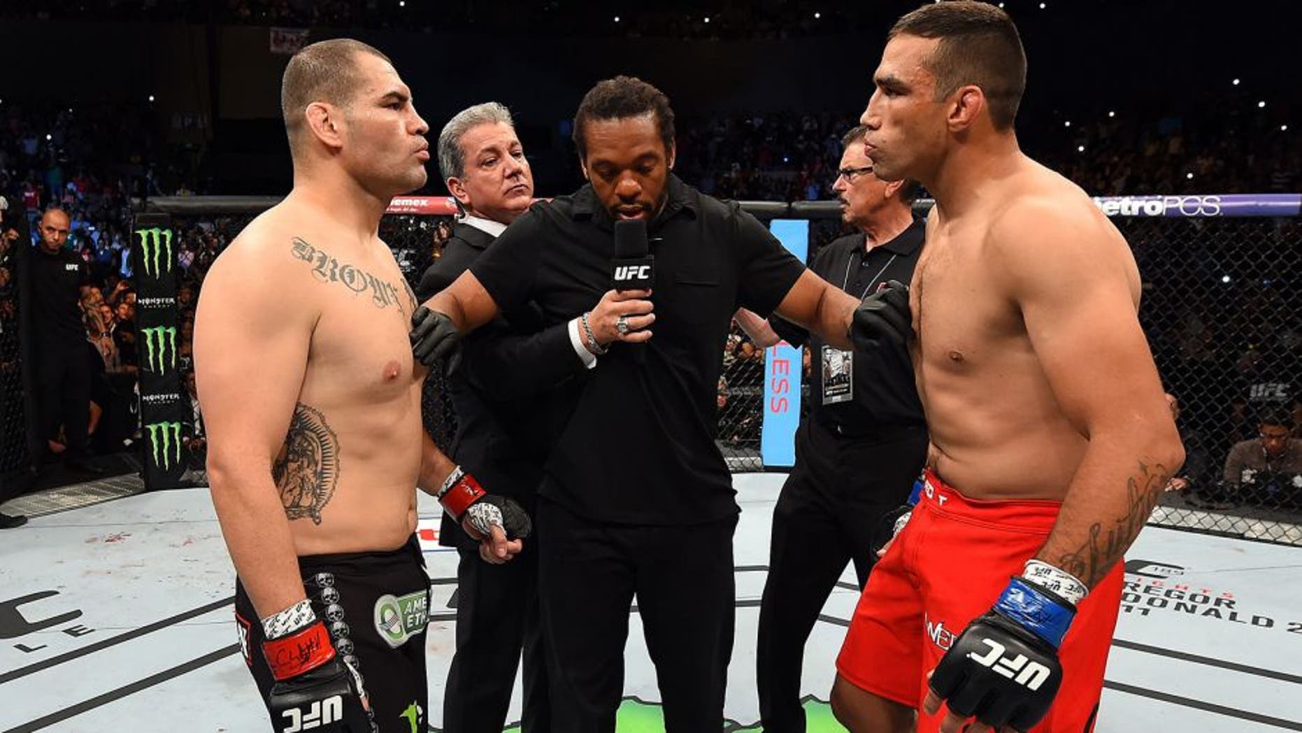 MEXICO CITY, MEXICO - JUNE 13: (L-R) Cain Velasquez of the United States and Fabricio Werdum of Brazil face off before their UFC heavyweight championship bout during the UFC 188 event inside the Arena Ciudad de Mexico on June 13, 2015 in Mexico City, Mexico. (Photo by Josh Hedges/Zuffa LLC/Zuffa LLC via Getty Images)