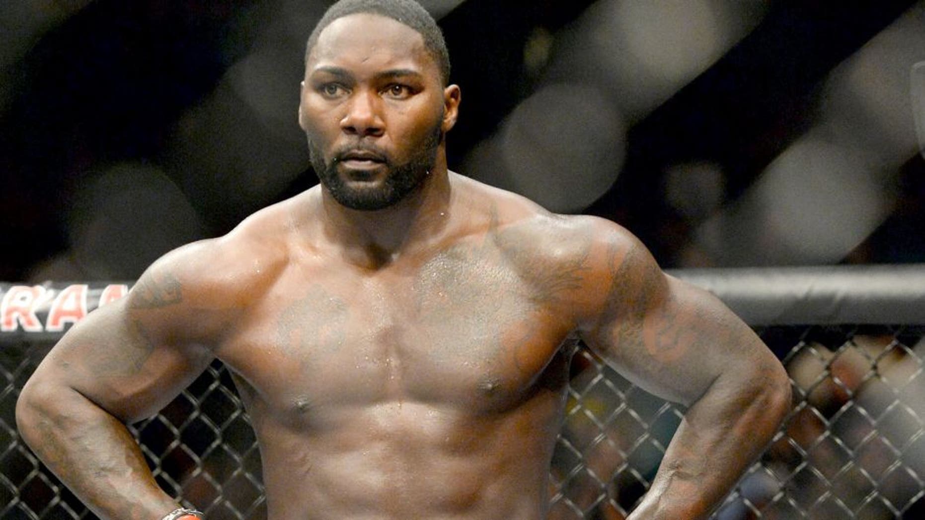 Sep 5, 2015; Las Vegas, NV, USA; Anthony Johnson (red gloves) stands in the ring after defeating Jimi Manuwa (not shown) following their light heavyweight bout at UFC 191 at MGM Grand Garden Arena. Mandatory Credit: Jayne Kamin-Oncea-USA TODAY Sports