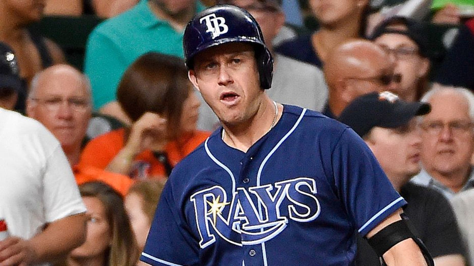 Tampa Bay Rays designated hitter Corey Dickerson (10) shakes hands with Evan Longoria after scoring a run on a wild pitch by Houston Astros' Mike Fiers during the third inning of a baseball game, Friday, Aug. 26, 2016, in Houston. (AP Photo/Eric Christian Smith)