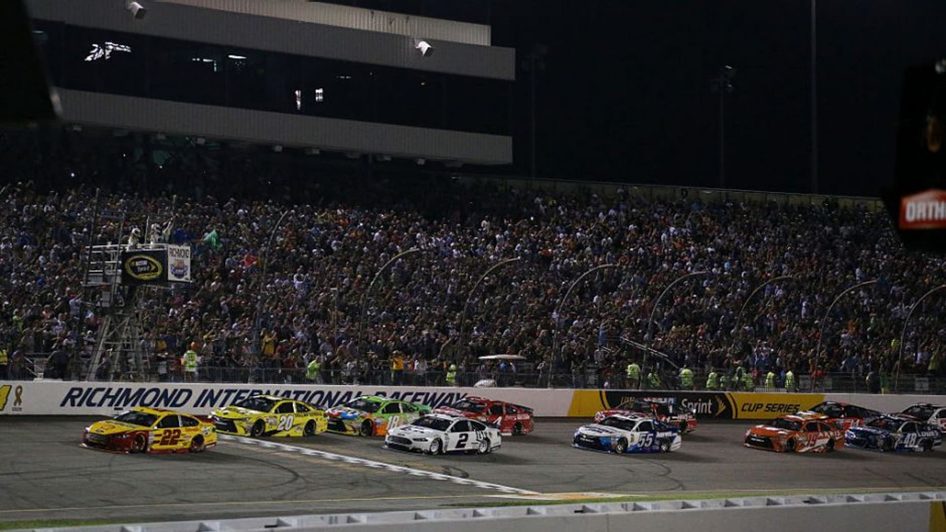 Joey Logano, driver of the #22 Shell Pennzoil Ford, leads a pack of cars during the NASCAR Sprint Cup Series Federated Auto Parts 400 at Richmond International Raceway on September 12, 2015 in Richmond, Virginia.