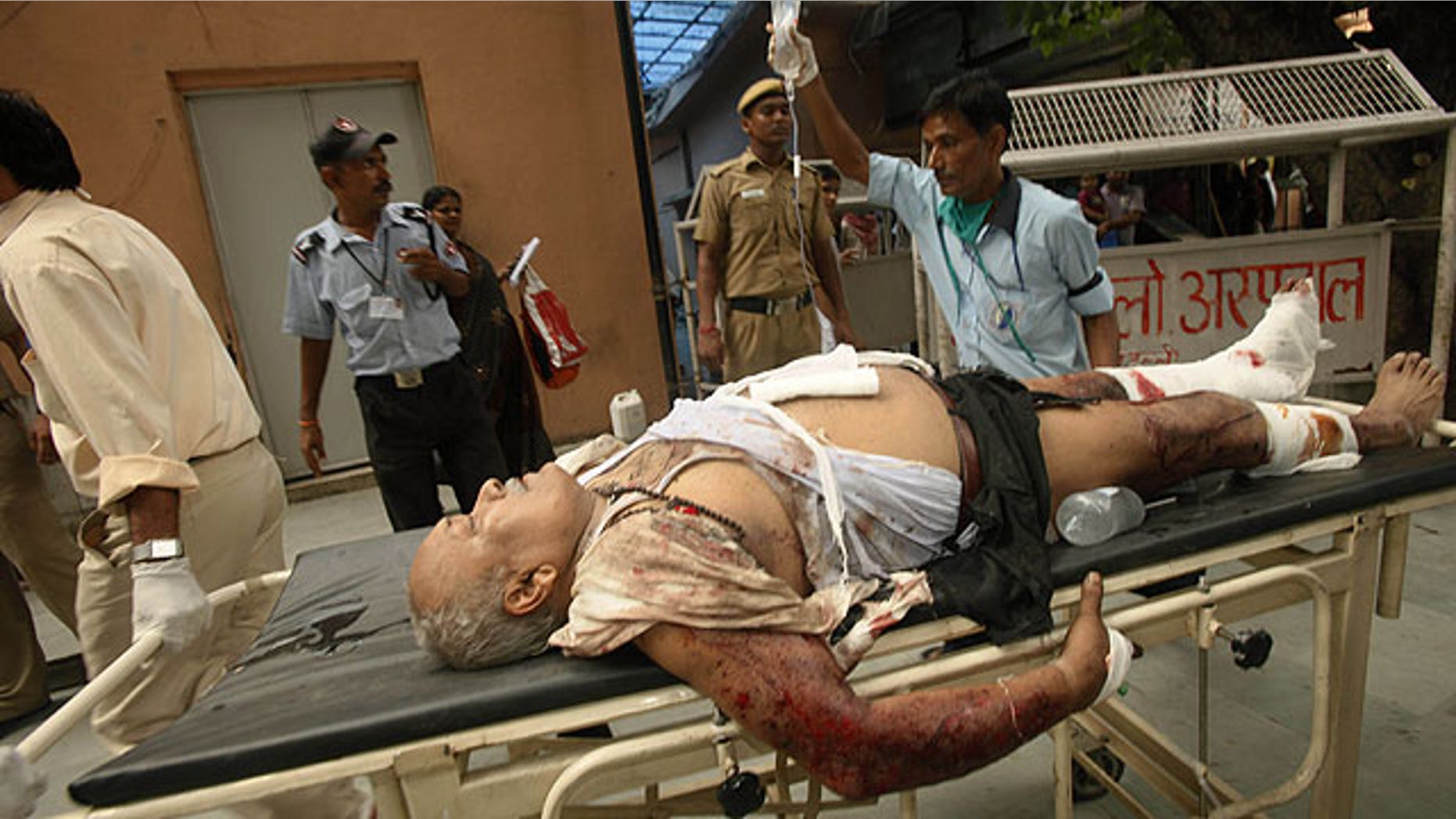 September 7: A man injured in bomb blast is brought to the RML hospital in New Delhi, India.