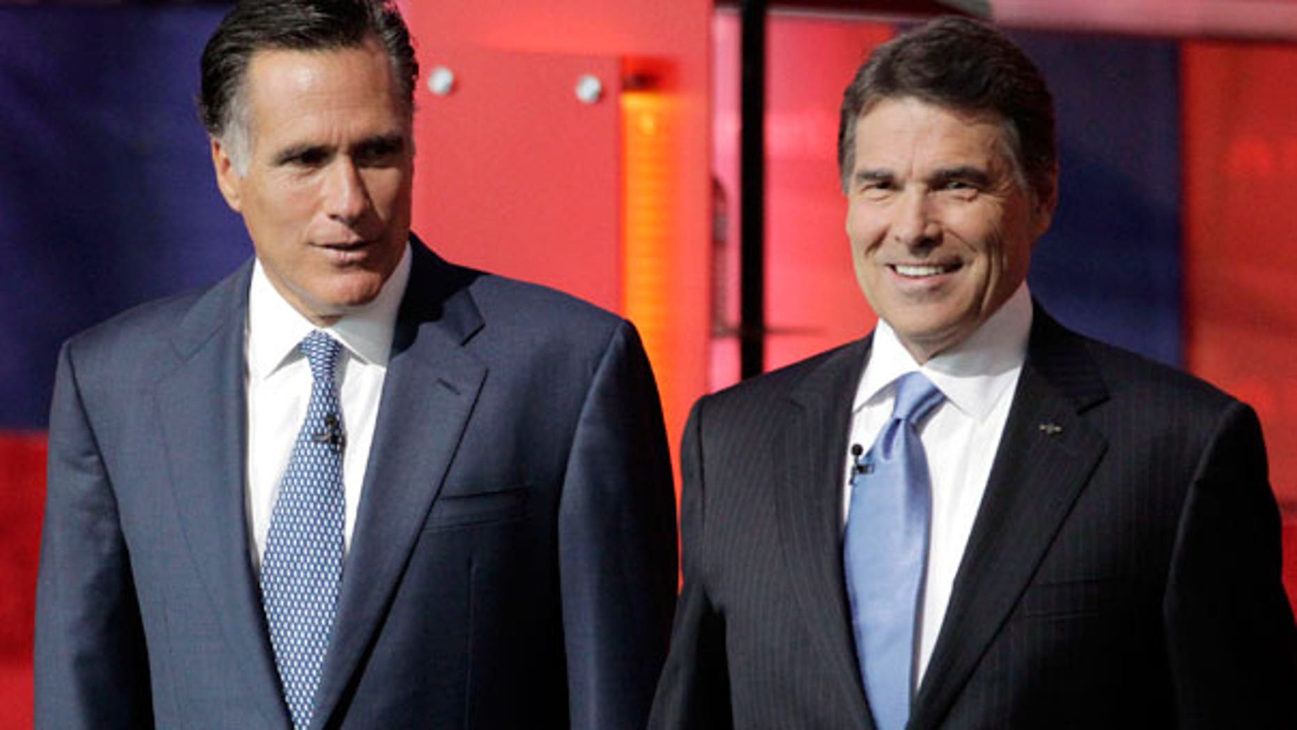 Spet. 7: Republican presidential candidates former Massachusetts Gov. Mitt Romney, left, and Texas Gov. Rick Perry, stand together before a Republican presidential candidate debate at the Reagan Library in Simi Valley, Calif.