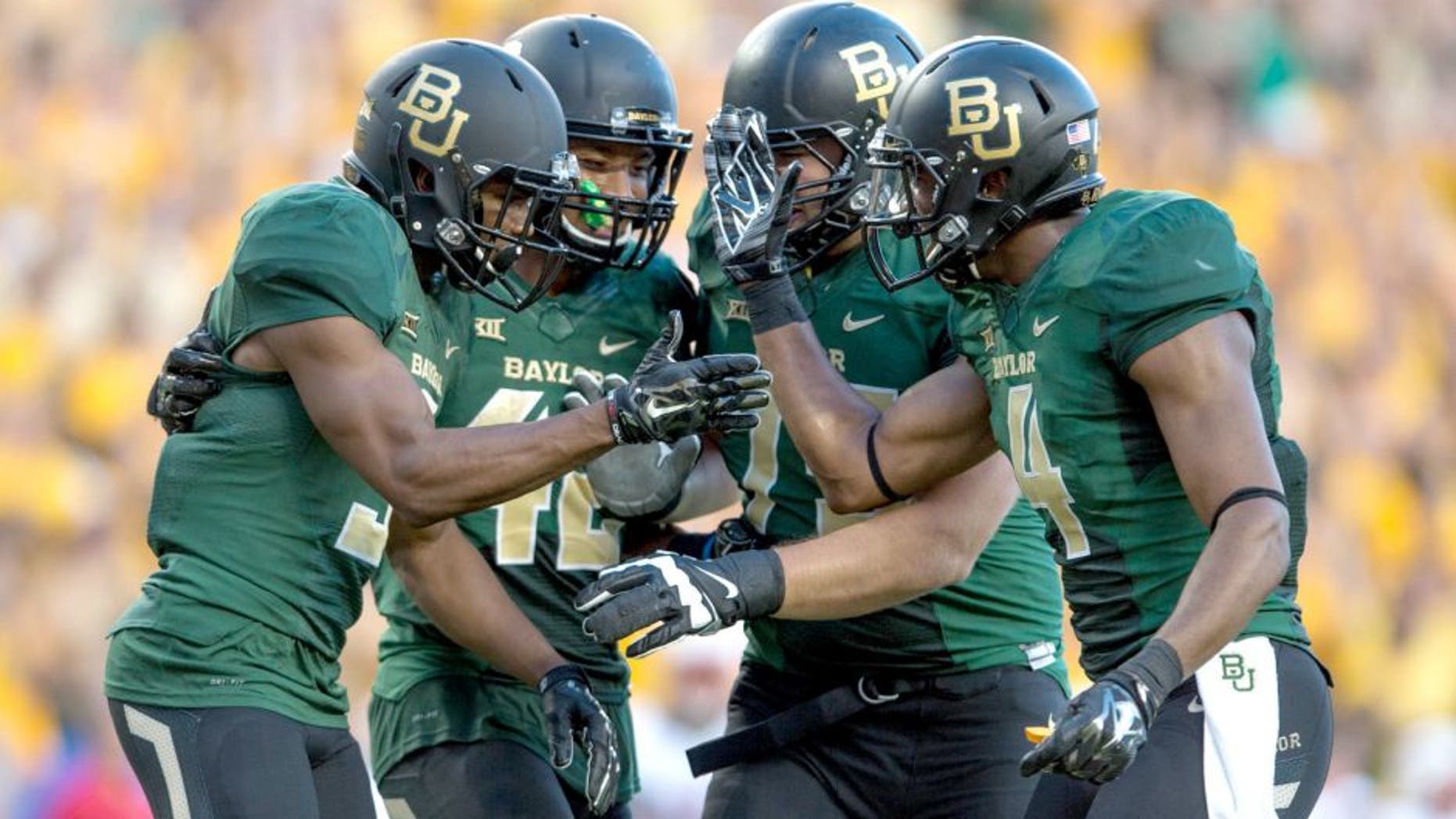 Aug 31, 2014; Waco, TX, USA; Baylor Bears wide receiver KD Cannon (9) and running back Levi Norwood (42) and wide receiver Jay Lee (4) celebrate Cannons touchdown against the Southern Methodist Mustangs during the first half at McLane Stadium. Mandatory Credit: Jerome Miron-USA TODAY Sports