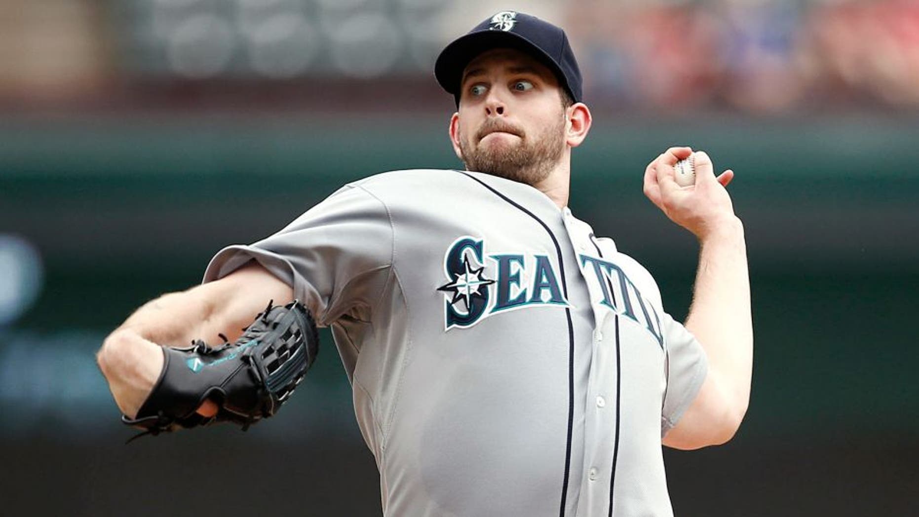 Sep 7, 2014; Arlington, TX, USA; Seattle Mariners starting pitcher James Paxton (65) delivers a pitch to the Texas Rangers during the third inning of a baseball game at Globe Life Park in Arlington. Mandatory Credit: Jim Cowsert-USA TODAY Sports