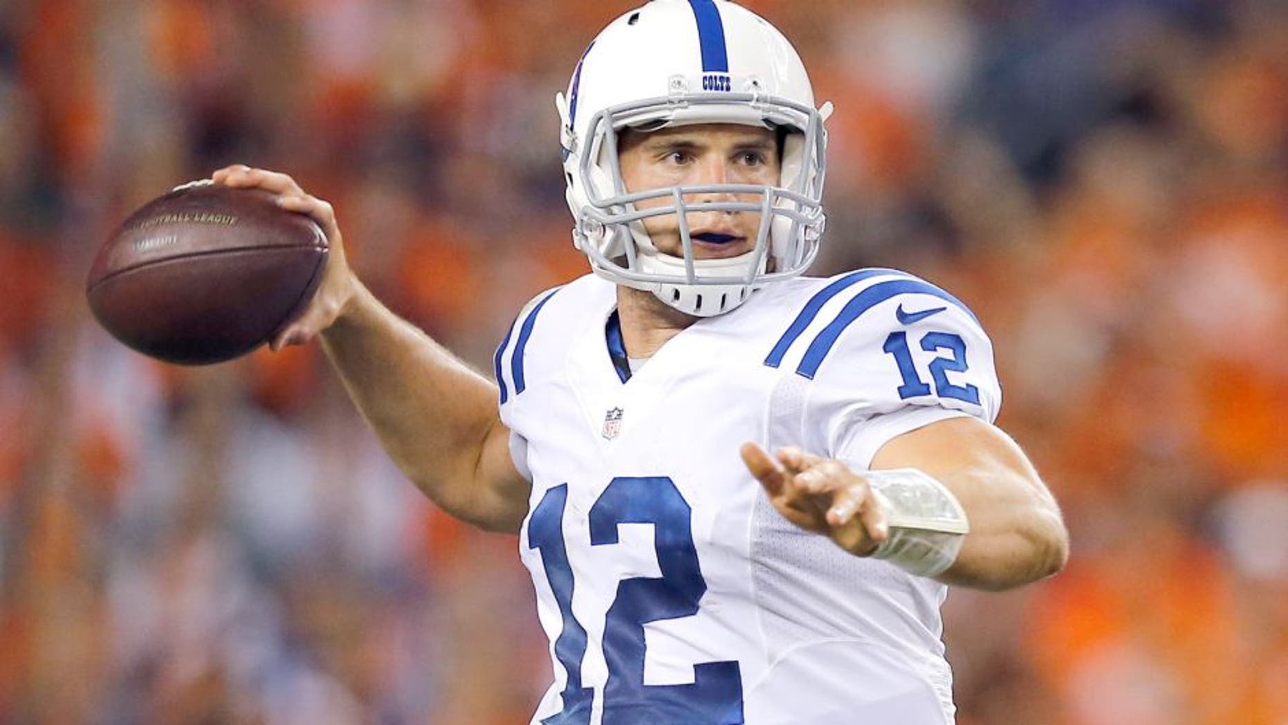 Indianapolis Colts quarterback Andrew Luck throws against the Denver Broncos during the second half of an NFL football game, Sunday, Sept. 7, 2014, in Denver. (AP Photo/Jack Dempsey)
