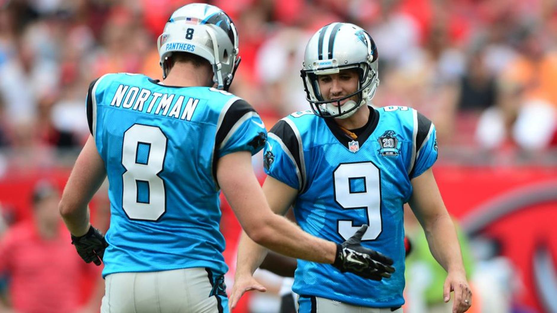 Sep 7, 2014; Tampa, FL, USA; Carolina Panthers punter Brad Nortman (8) congratulates kicker Graham Gano (9) after a field goal during the second quarter against the Tampa Bay Buccaneers at Raymond James Stadium. Mandatory Credit: Andrew Weber-USA TODAY Sports