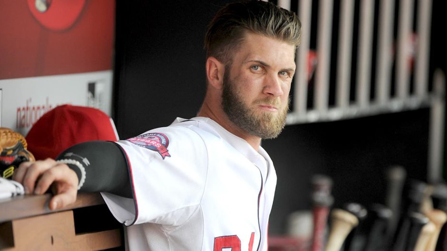 WASHINGTON, DC - AUGUST 30: Bryce Harper #34 of the Washington Nationals watches the game against the Miami Marlins at Nationals Park on August 30, 2015 in Washington, DC. (Photo by G Fiume/Getty Images)