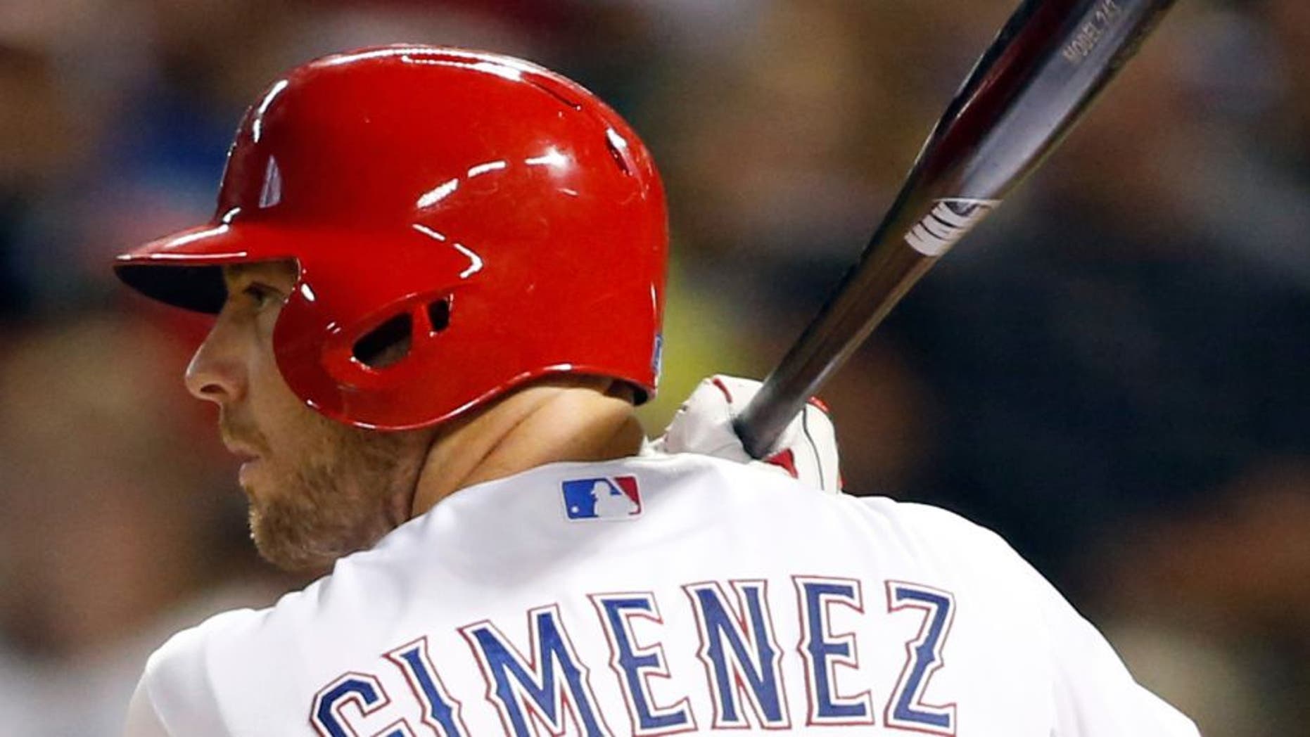 Aug 28, 2015; Arlington, TX, USA; Texas Rangers catcher Chris Gimenez (38) bats in the seventh inning against the Baltimore Orioles at Globe Life Park in Arlington. Texas won 4-1. Mandatory Credit: Tim Heitman-USA TODAY Sports