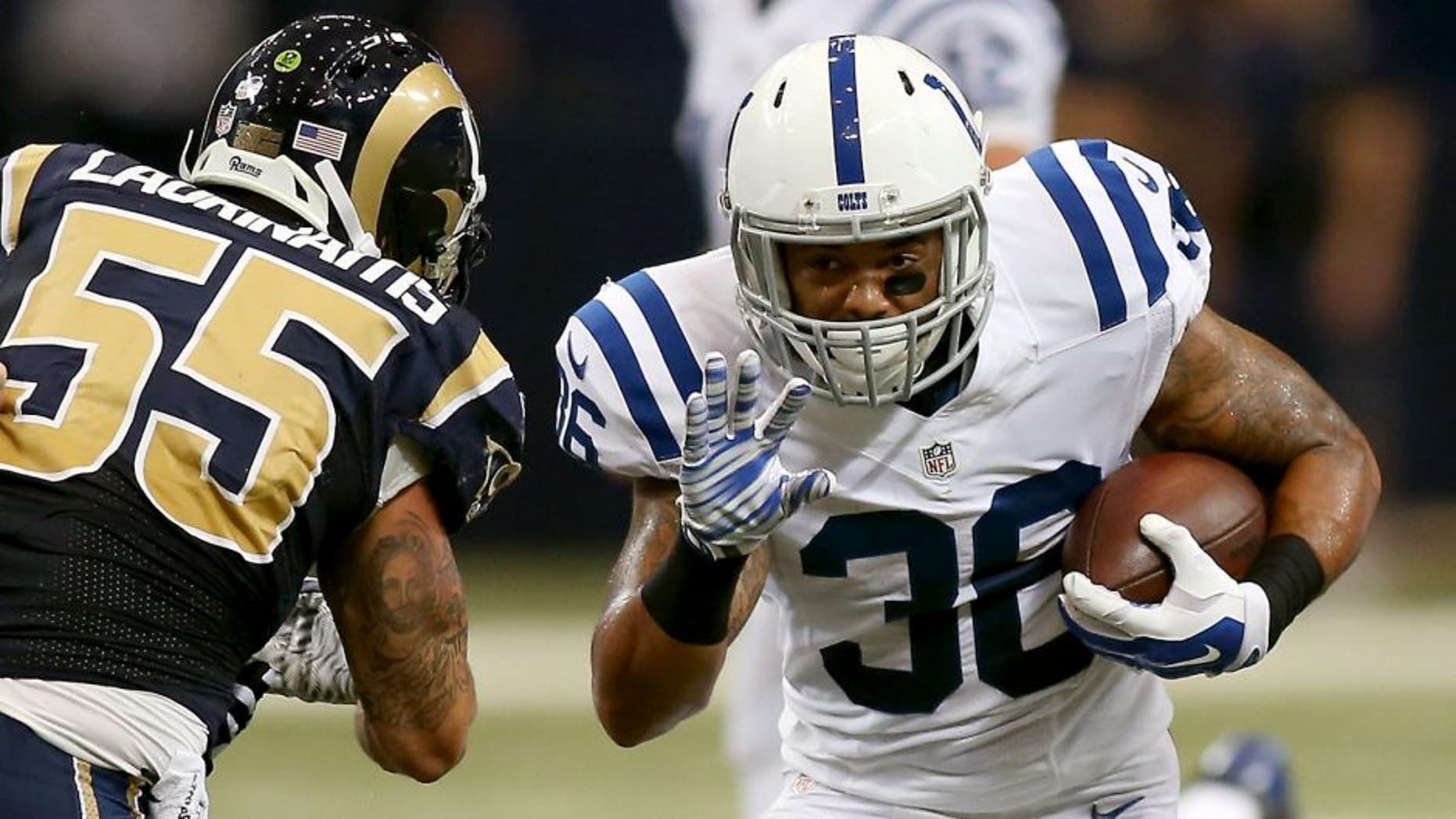 Aug 29, 2015; St. Louis, MO, USA; Indianapolis Colts running back Dan Herron (36) carries the ball past St. Louis Rams middle linebacker James Laurinaitis (55) during the first quarter of a football game at the Edward Jones Dome. Mandatory Credit: Scott Kane-USA TODAY Sports