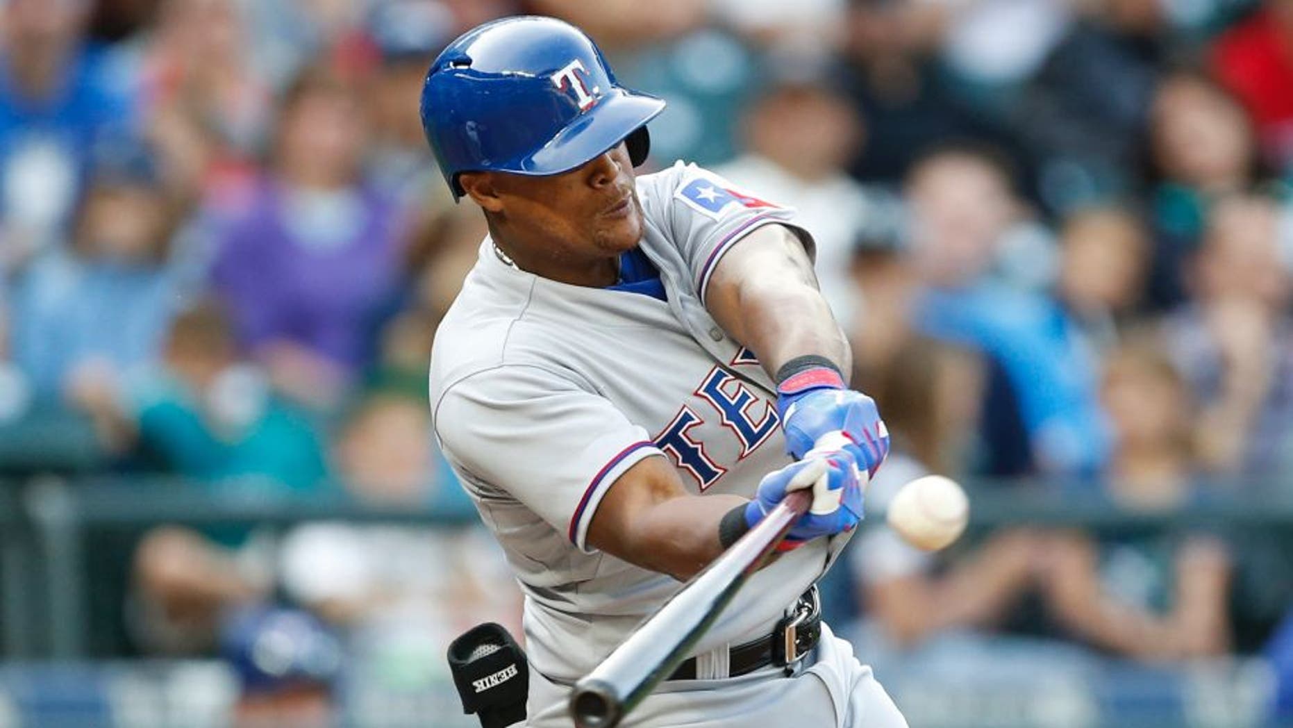 Sep 7, 2015; Seattle, WA, USA; Texas Rangers third baseman Adrian Beltre (29) hits a two-run RBI single in the sixth inning against the Seattle Mariners at Safeco Field. Mandatory Credit: Jennifer Buchanan-USA TODAY Sports