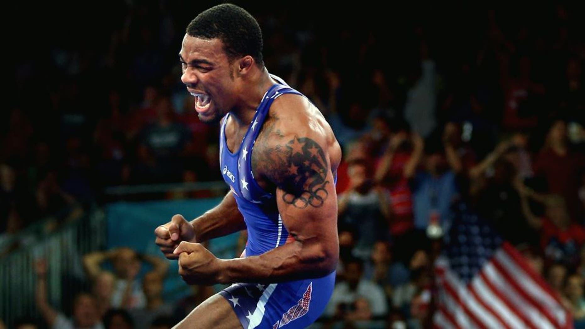 LONDON, ENGLAND - AUGUST 10: Jordan Ernest Burroughs of the United States celebrates his gold medal in the Men's Freestyle 74 kg Wrestling on Day 14 of the London 2012 Olympic Games at ExCeL on August 10, 2012 in London, England. (Photo by Feng Li/Getty Images)