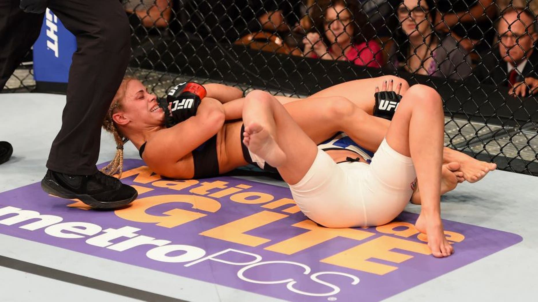 LAS VEGAS, NV - SEPTEMBER 05: Paige VanZant attempts to submit Alex Chambers (white trunks) in their women's strawweight bout during the UFC 191 event inside MGM Grand Garden Arena on September 5, 2015 in Las Vegas, Nevada. (Photo by Josh Hedges/Zuffa LLC/Zuffa LLC via Getty Images)