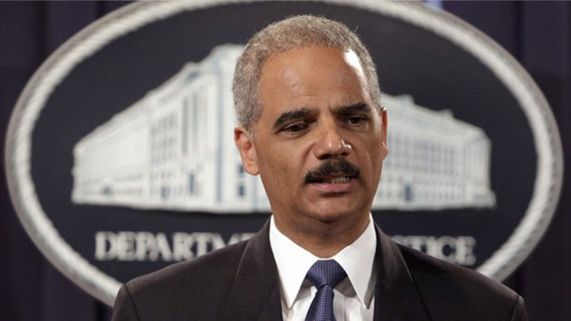 August 3: U.S. Attorney General Eric Holder holds a news conference in Washington