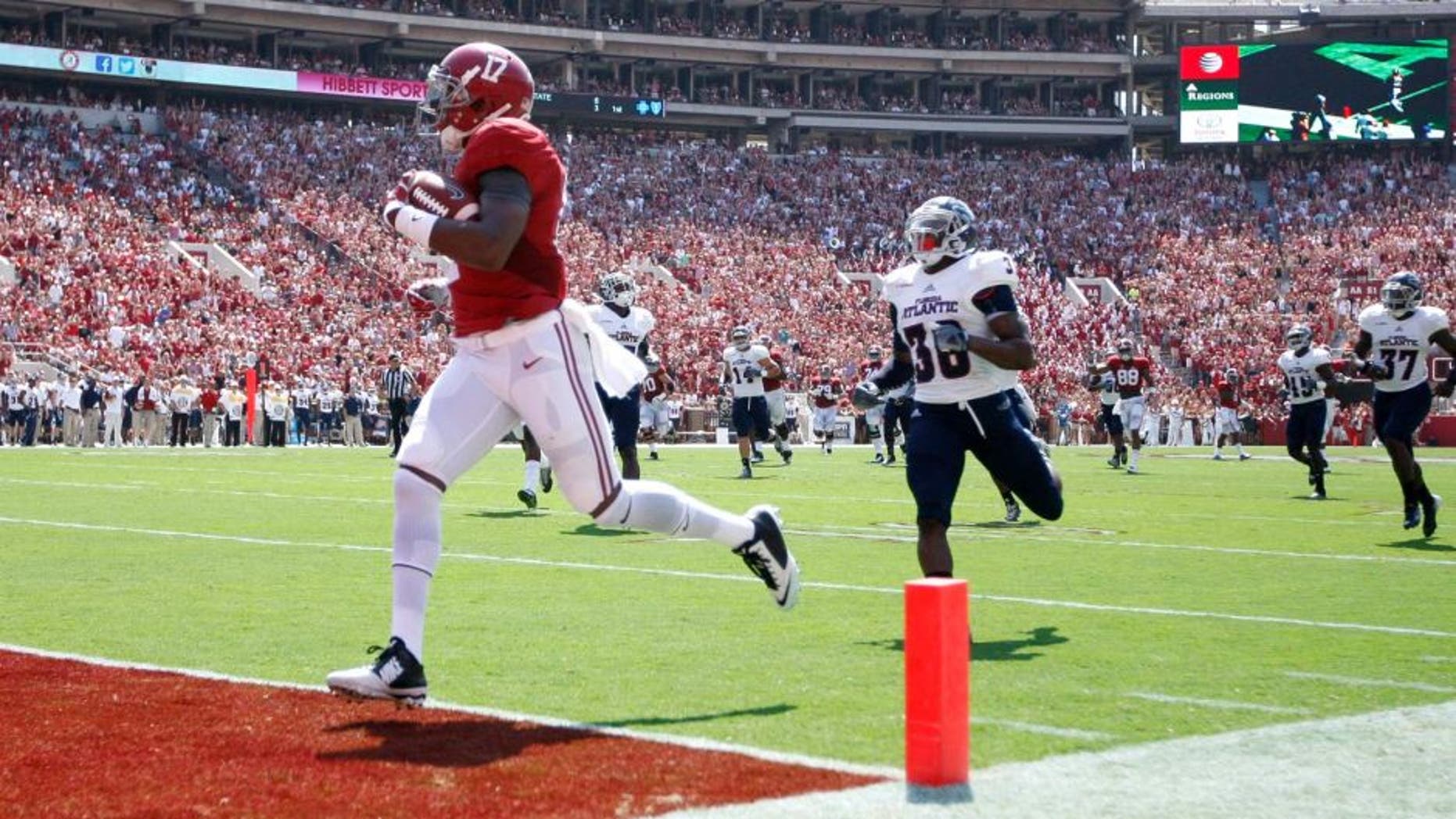 Sep 6, 2014; Tuscaloosa, AL, USA; Alabama Crimson Tide running back Kenyan Drake (17) scores against the Florida Atlantic Owls at Bryant-Denny Stadium. Mandatory Credit: Marvin Gentry-USA TODAY Sports
