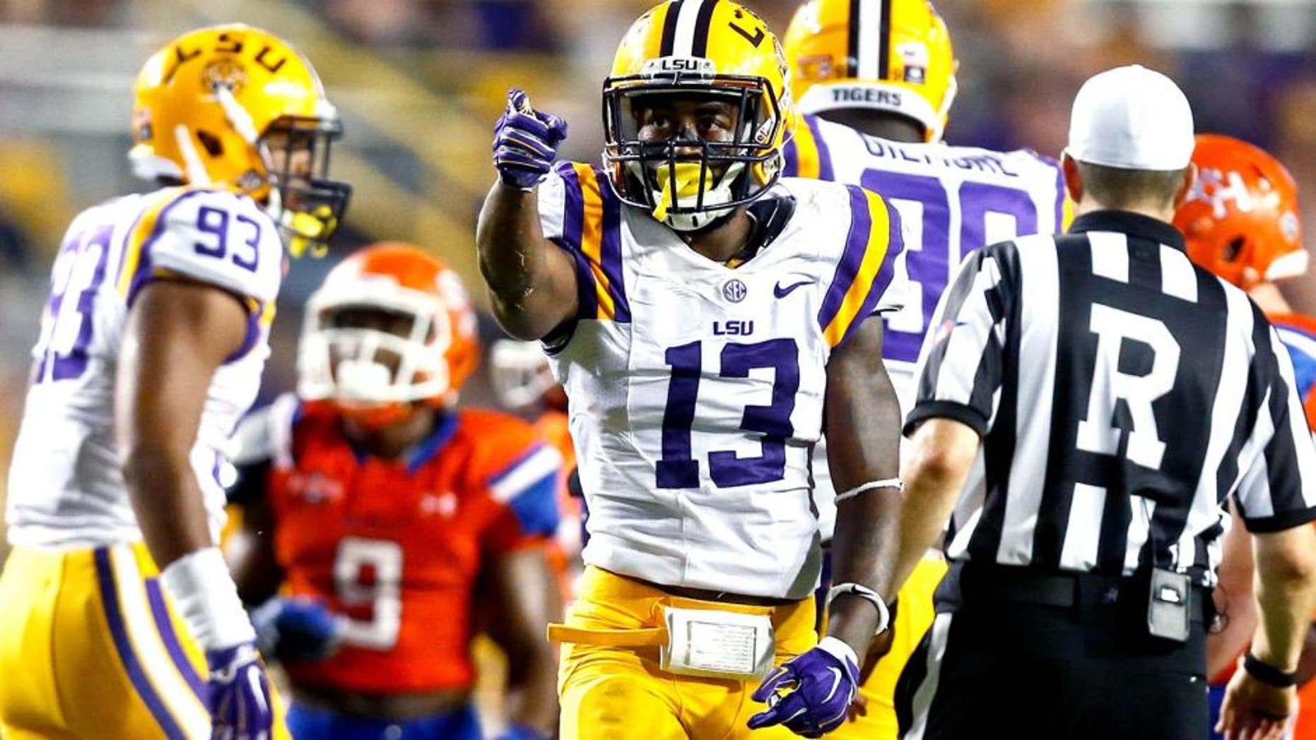 Sep 6, 2014; Baton Rouge, LA, USA; LSU Tigers cornerback Dwayne Thomas (13) celebrates after a sack against the Sam Houston State Bearkats during the second half of a game at Tiger Stadium. LSU defeated Sam Houston 56-0. Mandatory Credit: Derick E. Hingle-USA TODAY Sports