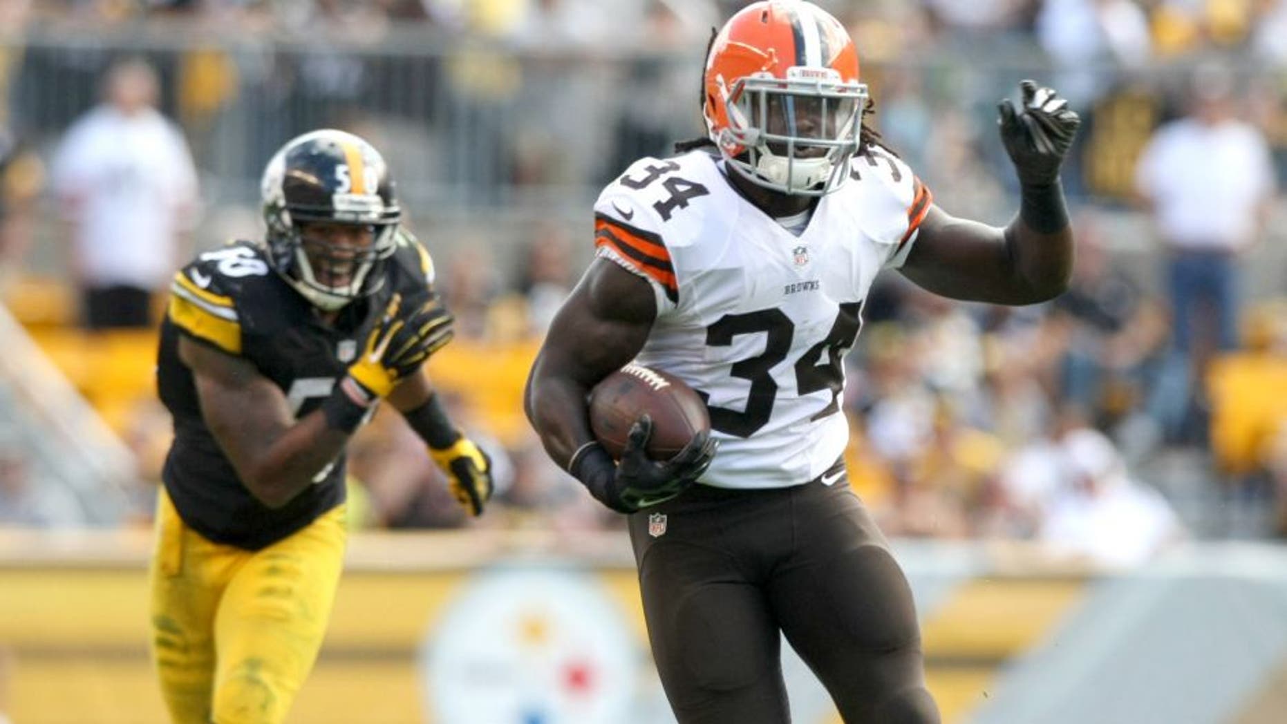 Sep 7, 2014; Pittsburgh, PA, USA; Cleveland Browns running back Isaiah Crowell (34) runs the ball past Pittsburgh Steelers linebacker Ryan Shazier (50) during the second half at Heinz Field. Pittsburgh won the game, 30-27. Mandatory Credit: Jason Bridge-USA TODAY Sports