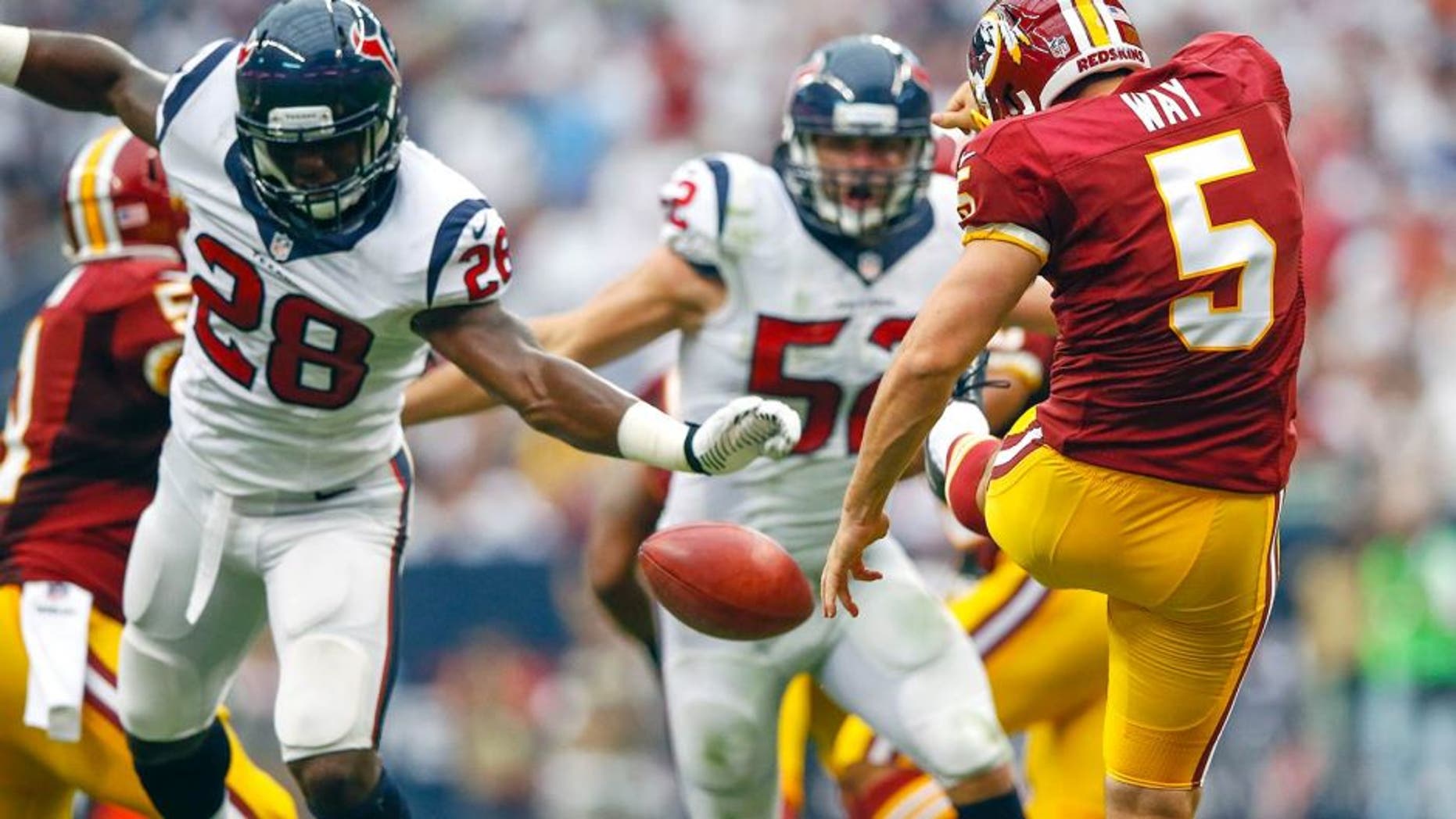 Sep 7, 2014; Houston, TX, USA; Houston Texans running back Alfred Blue (28) blocks the punt of Washington Redskins punter Tress Way (5) and scores a touchdown during the first half at NRG Stadium. Mandatory Credit: Kevin Jairaj-USA TODAY Sports