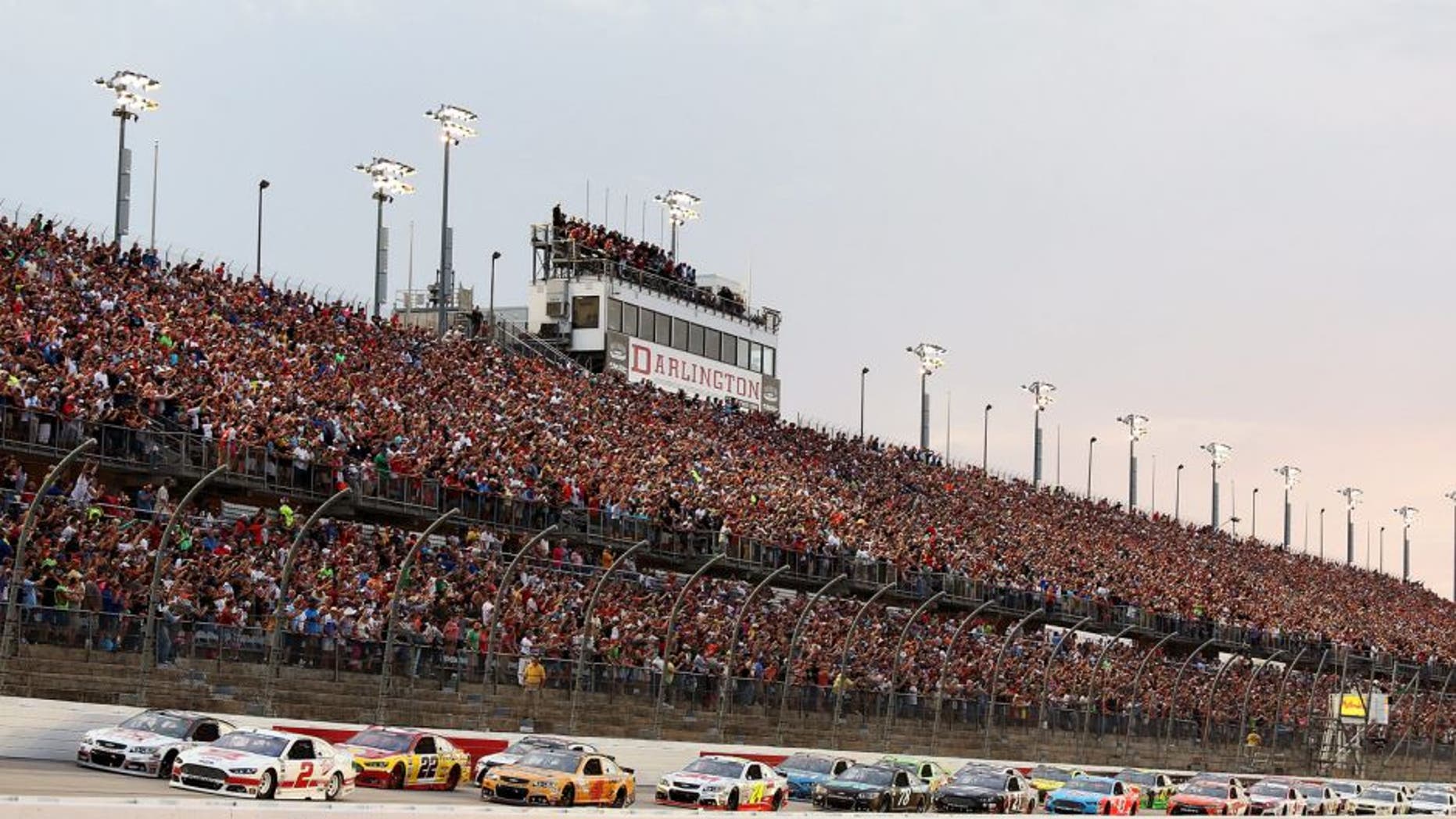 Brad Keselowski, driver of the #2 Miller High Life Ford, and Kurt Busch, driver of the #41 Haas Automation Chevrolet, lead the field to the green flag for the running of the NASCAR Sprint Cup Series Bojangles' Southern 500 at Darlington Raceway on September 6, 2015 in Darlington, South Carolina. (Photo by Jerry Markland/Getty Images)