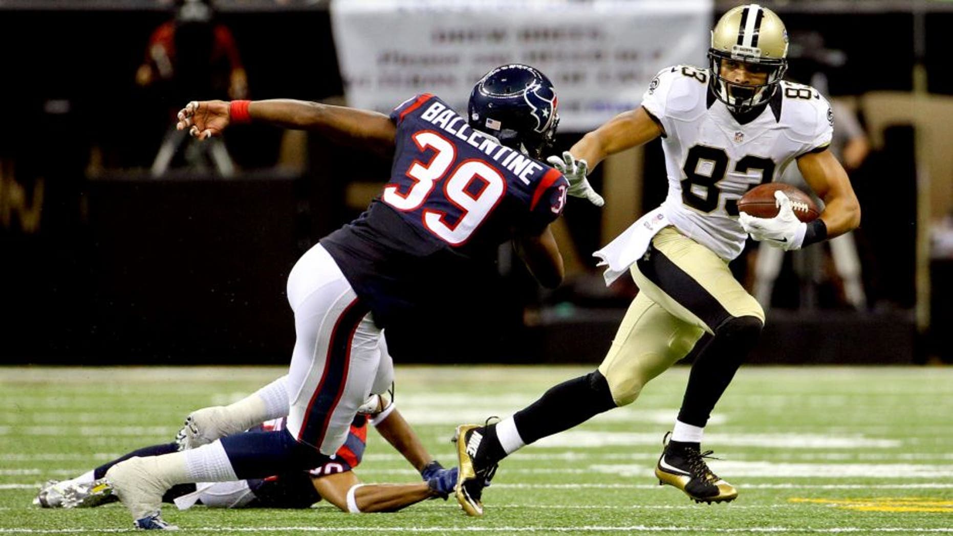 Aug 30, 2015; New Orleans, LA, USA; New Orleans Saints wide receiver Willie Snead (83) escapes from Houston Texans cornerback Kevin Johnson (30) and safety Lonnie Ballentine (39) during the first half of a preseason game at the Mercedes-Benz Superdome. Mandatory Credit: Derick E. Hingle-USA TODAY Sports