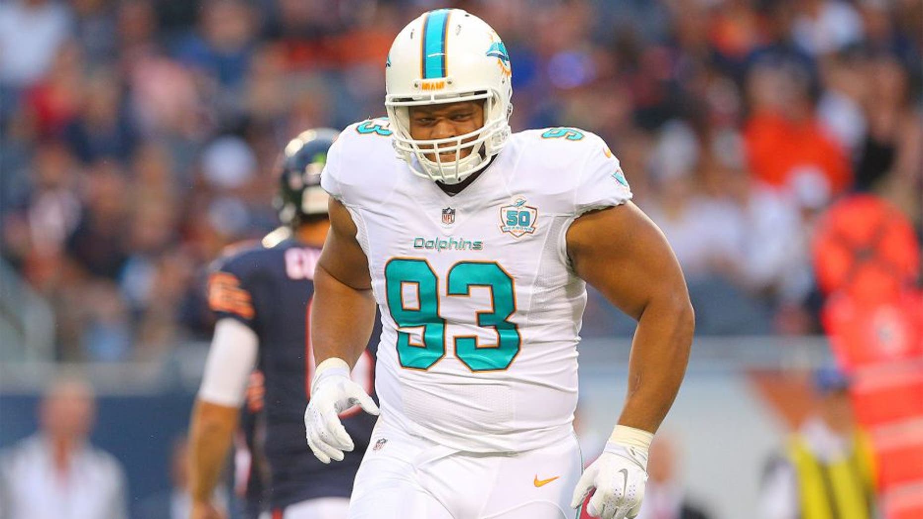 Aug 13, 2015; Chicago, IL, USA; Miami Dolphins defensive tackle Ndamukong Suh (93) reacts to a play during the first quarter of a preseason NFL football game against the Chicago Bears at Soldier Field. Mandatory Credit: Dennis Wierzbicki-USA TODAY Sports
