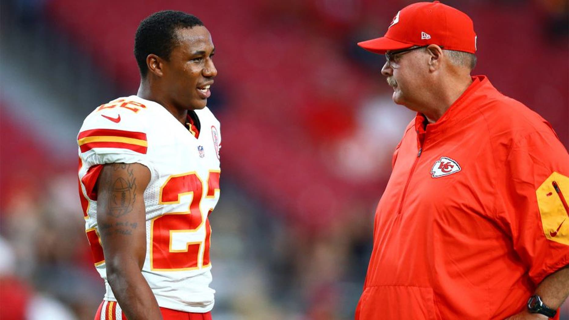 Aug 15, 2015; Glendale, AZ, USA; Kansas City Chiefs cornerback Marcus Peters (left) with head coach Andy Reid prior to the game against the Arizona Cardinals during a preseason NFL football game at University of Phoenix Stadium. Mandatory Credit: Mark J. Rebilas-USA TODAY Sports