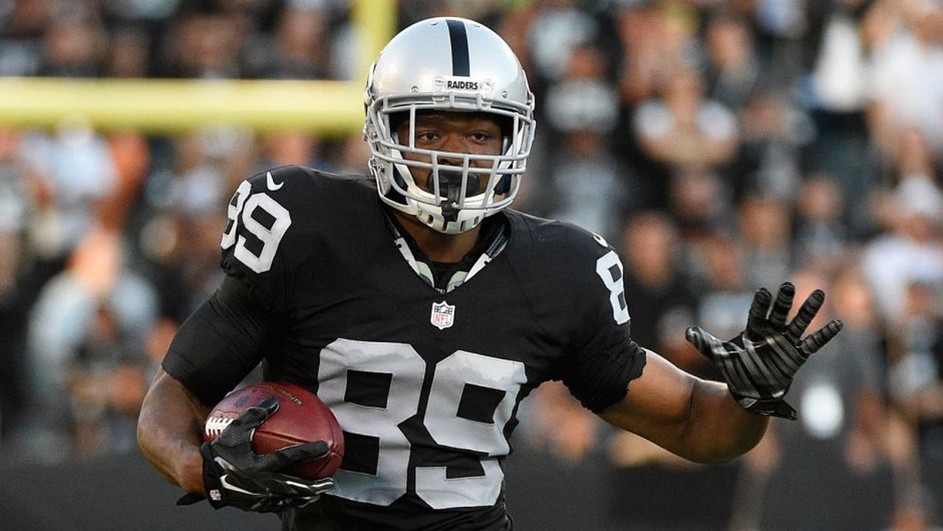 August 14, 2015; Oakland, CA, USA; Oakland Raiders wide receiver Amari Cooper (89) runs with the football against the St. Louis Rams during the first quarter in a preseason NFL football game at O.co Coliseum. Mandatory Credit: Kyle Terada-USA TODAY Sports