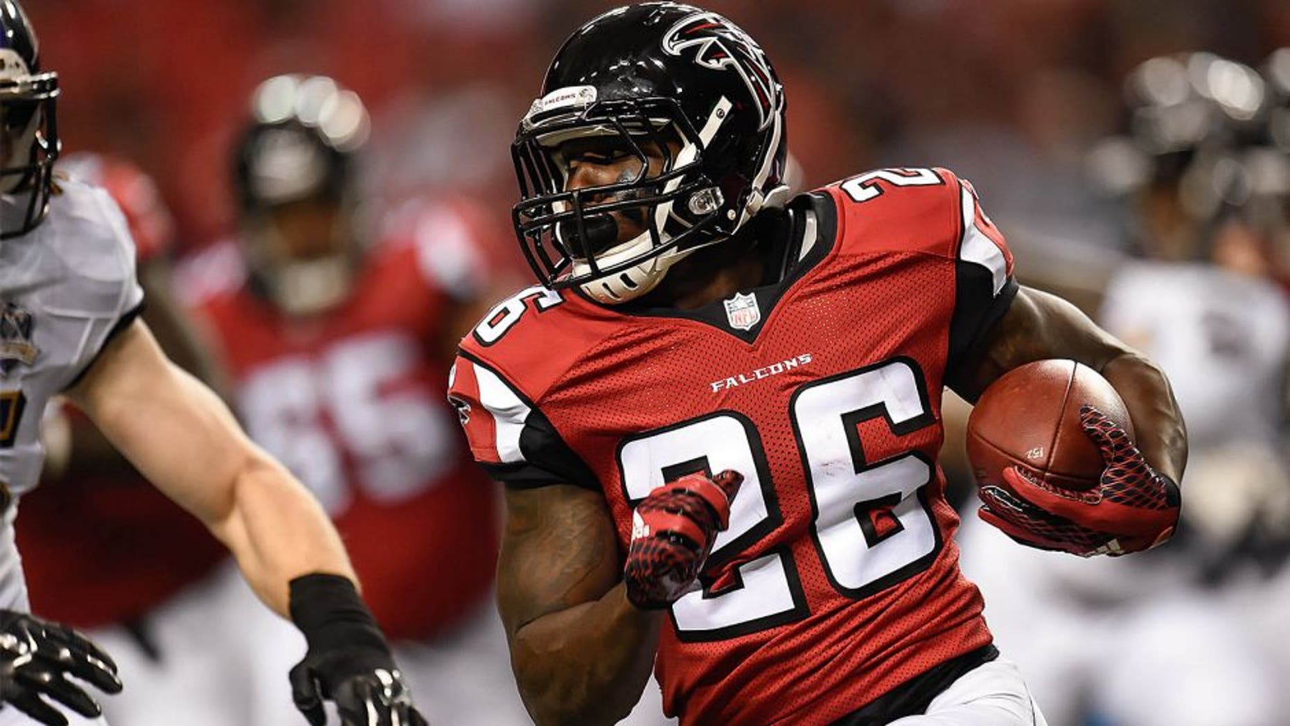 Sep 3, 2015; Atlanta, GA, USA; Atlanta Falcons running back Tevin Coleman (26) runs with the ball against the Baltimore Ravens during the first quarter at the Georgia Dome. Mandatory Credit: Dale Zanine-USA TODAY Sports