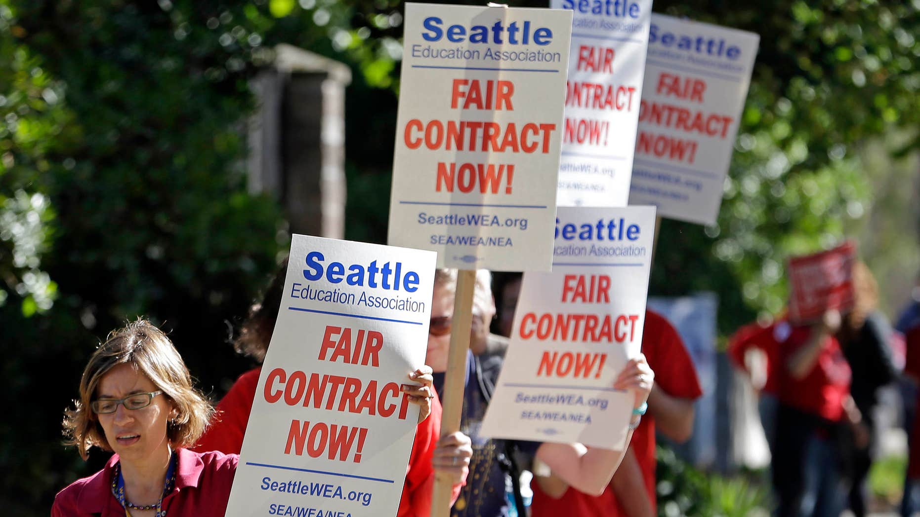 SEpt. 2, 2015: About 50 teachers picket and chant as they picket outside West Seattle High School in Seattle.