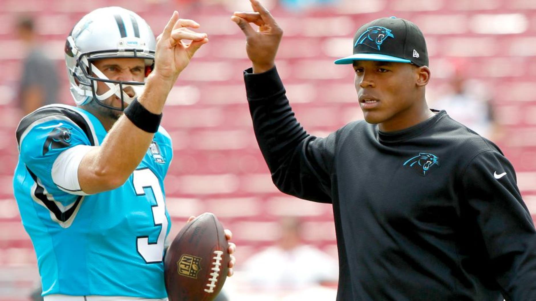 Sep 7, 2014; Tampa, FL, USA; Carolina Panthers quarterback Derek Anderson (3) and quarterback Cam Newton (1) prior to the game against the Tampa Bay Buccaneers at Raymond James Stadium. Mandatory Credit: Kim Klement-USA TODAY Sports