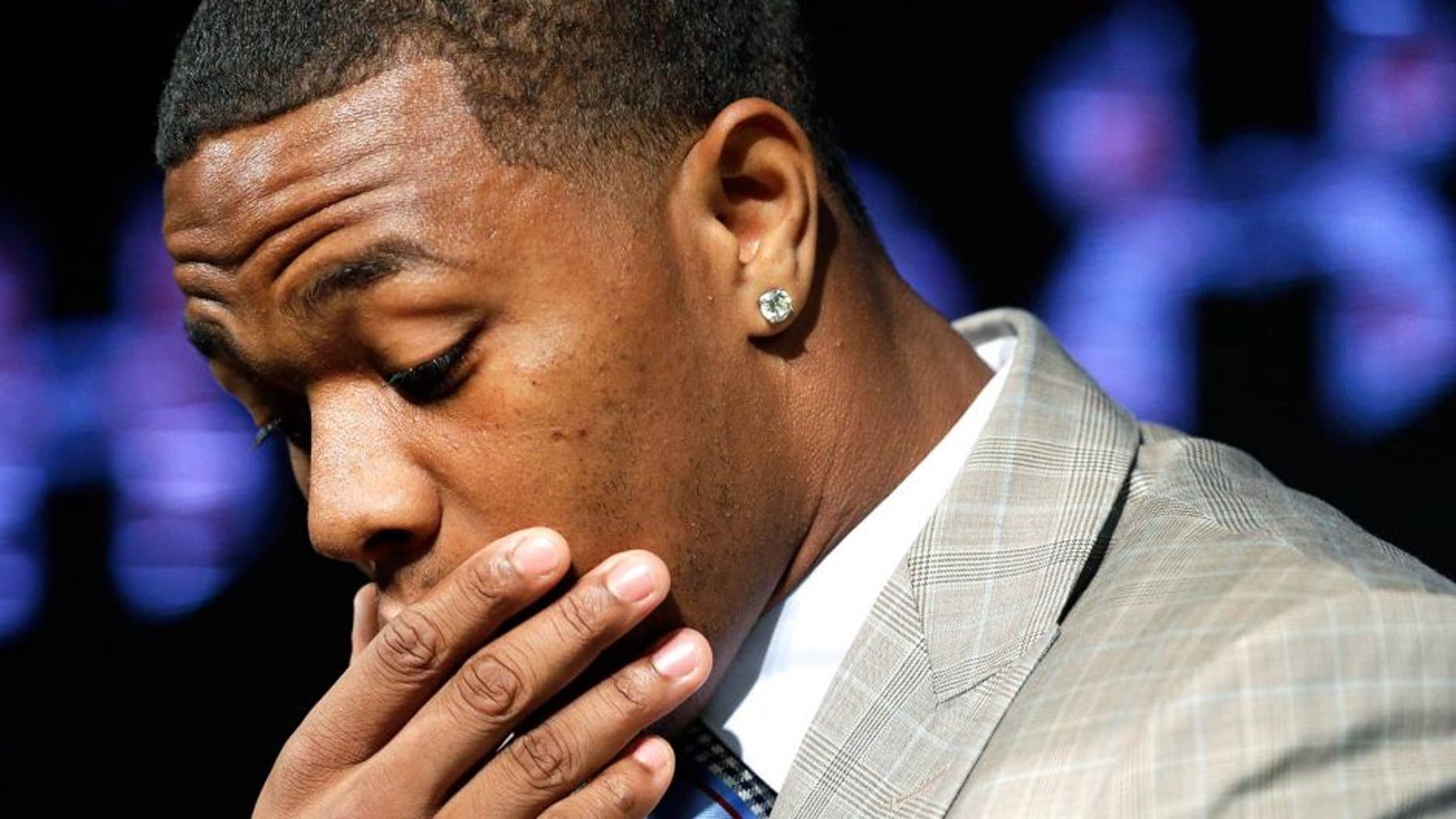 FILE - In this May 23, 2014, file photo, Baltimore Ravens running back Ray Rice pauses as he speaks during a news conference at the team's practice facility in Owings Mills, Md. A new video that appears to show Ray Rice striking then-fiance Janay Palmer in an elevator last February has been released on a website. (AP Photo/Patrick Semansky, File)