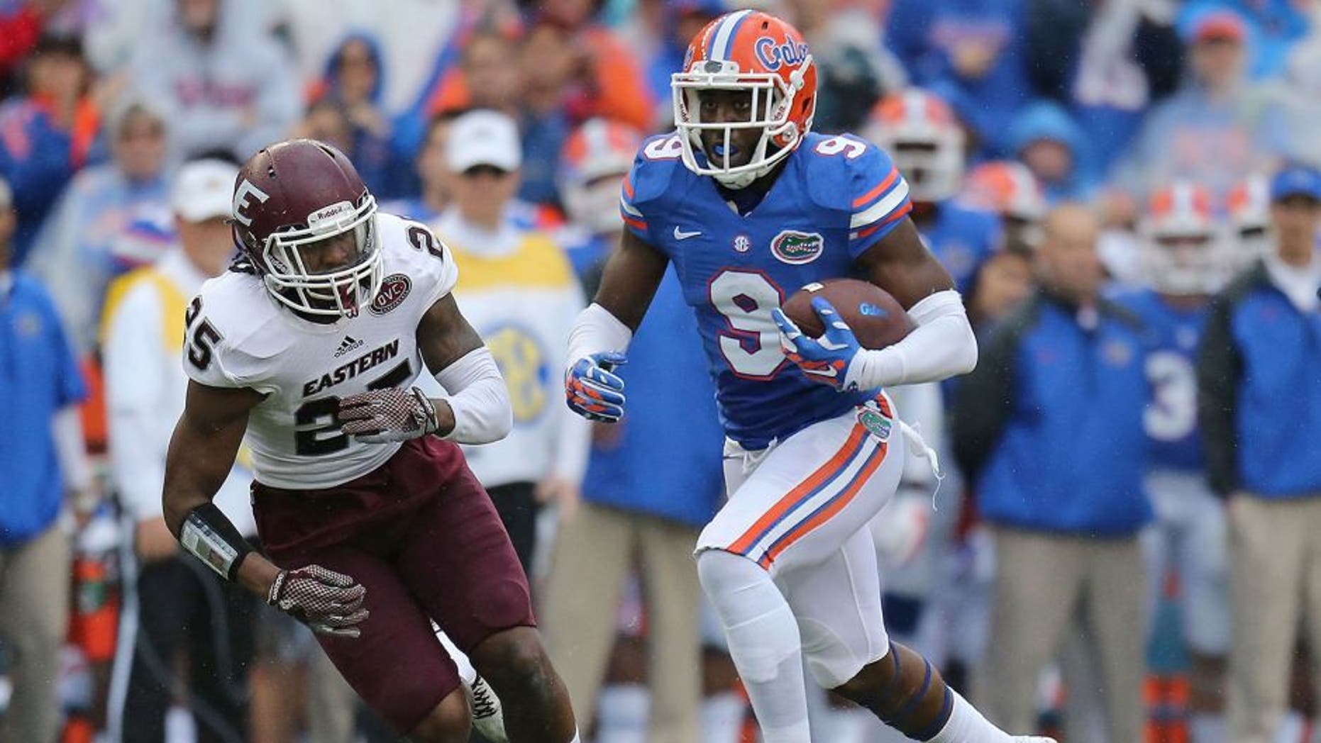 GAINESVILLE, FL - NOVEMBER 22: Latroy Pittman, Jr. #9 of the Florida Gators is defended by Chris Owens #25 of the Eastern Kentucky Colonels during the game at Ben Hill Griffin Stadium on November 22, 2014 in Gainesville, Florida. (Photo by Rob Foldy/Getty Images)