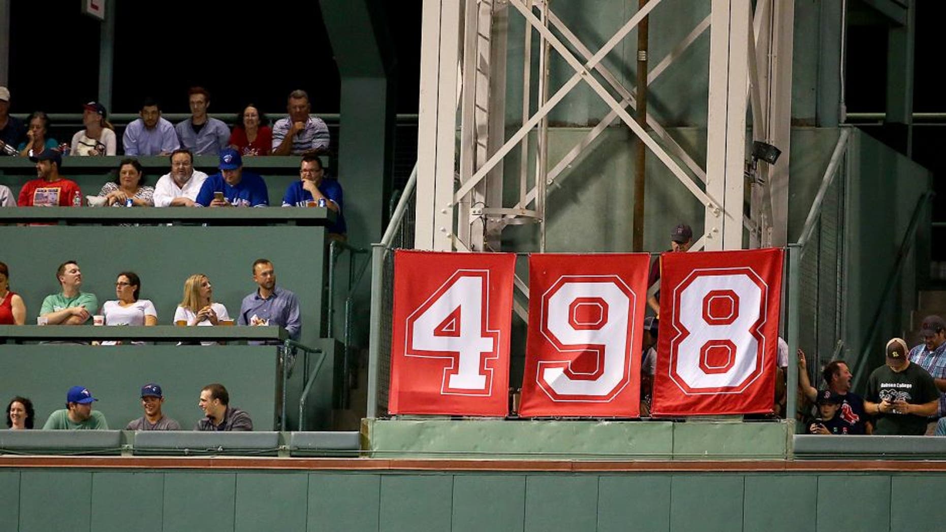 BOSTON, MA - SEPTEMBER 09: A banner celebrating David Ortiz #34 of the Boston Red Sox's 498th career home run hangs on the Green Monster during the third inning against the Toronto Blue Jays at Fenway Park on September 9, 2015 in Boston, Massachusetts. (Photo by Maddie Meyer/Getty Images)