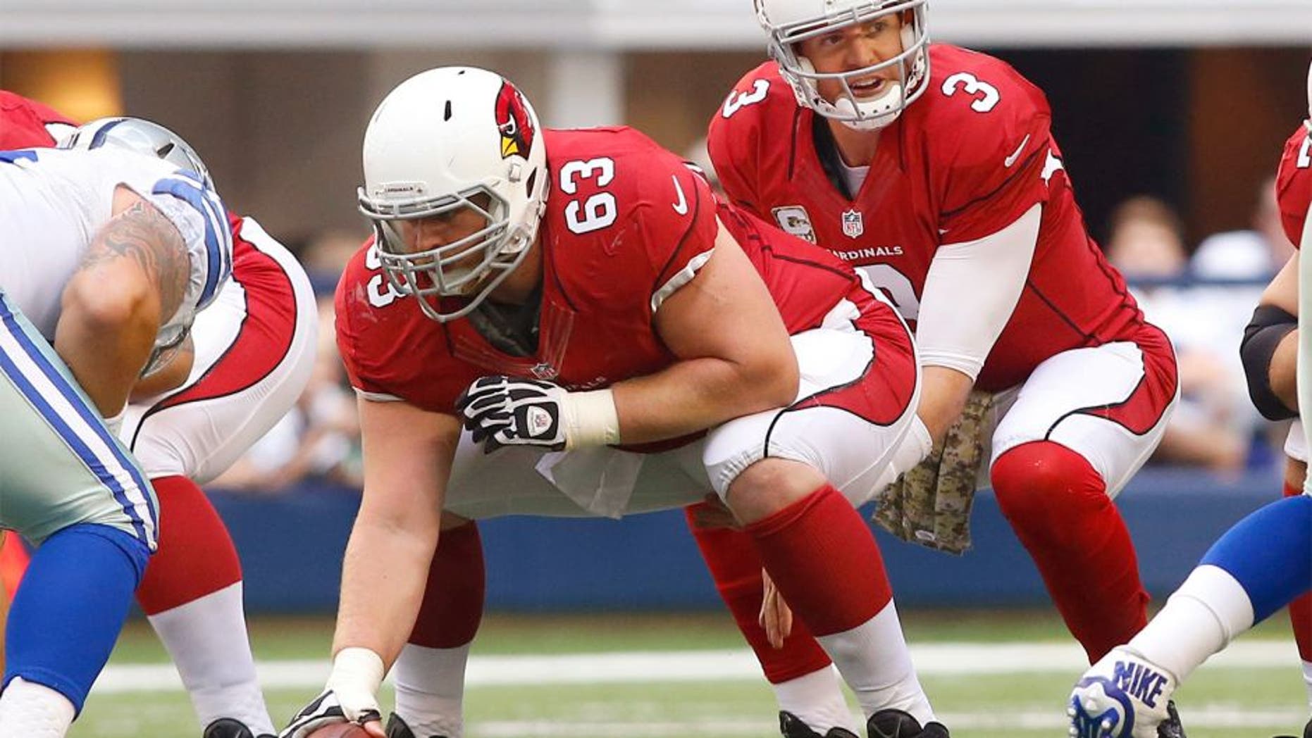 Nov 2, 2014; Arlington, TX, USA; Arizona Cardinals quarterback Carson Palmer (3) at the line of scrimmage with center Lyle Sendlein (63) against the Dallas Cowboys at AT&T Stadium. Arizona beat Dallas 28-17. Mandatory Credit: Tim Heitman-USA TODAY Sports