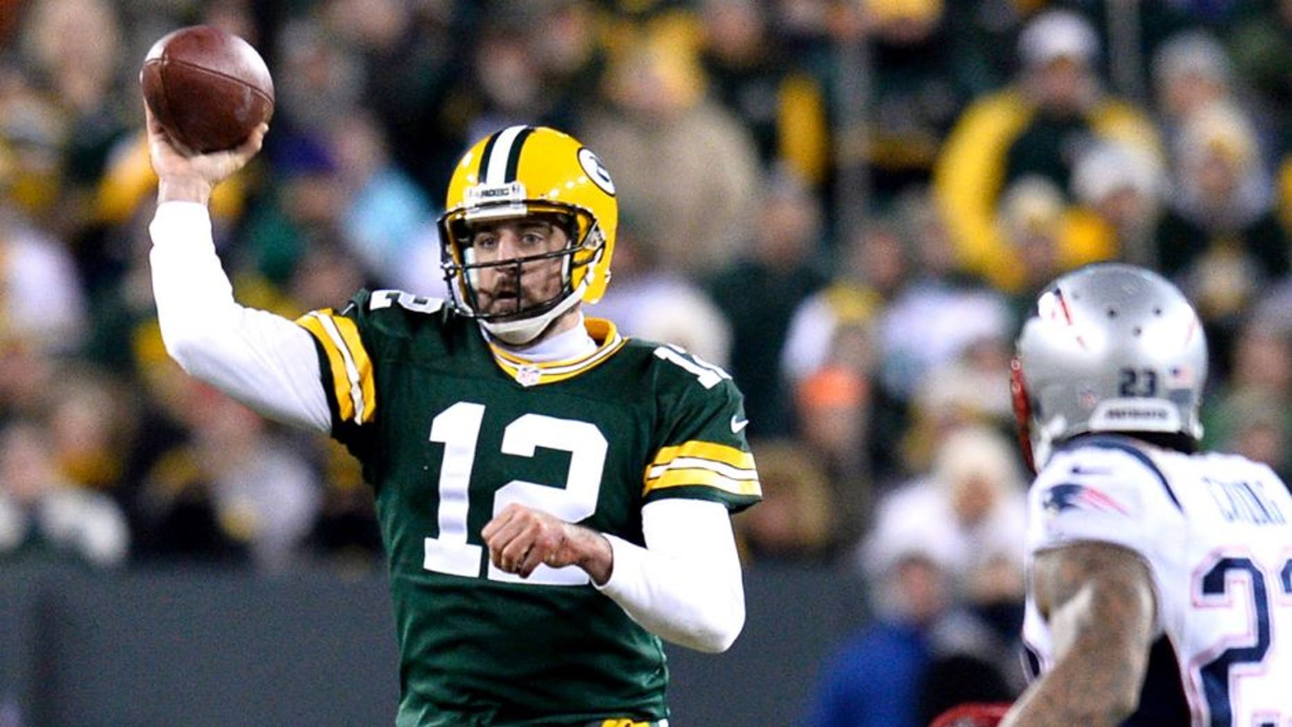 GREEN BAY, WI - NOVEMBER 30: Aaron Rodgers #12 of the Green Bay Packers throws a pass against the New England Patriots during the second quarter at Lambeau Field on November 30, 2014 in Green Bay, Wisconsin. The Packers defeated the Patriots 26-21. (Photo by Brian D. Kersey/Getty Images)
